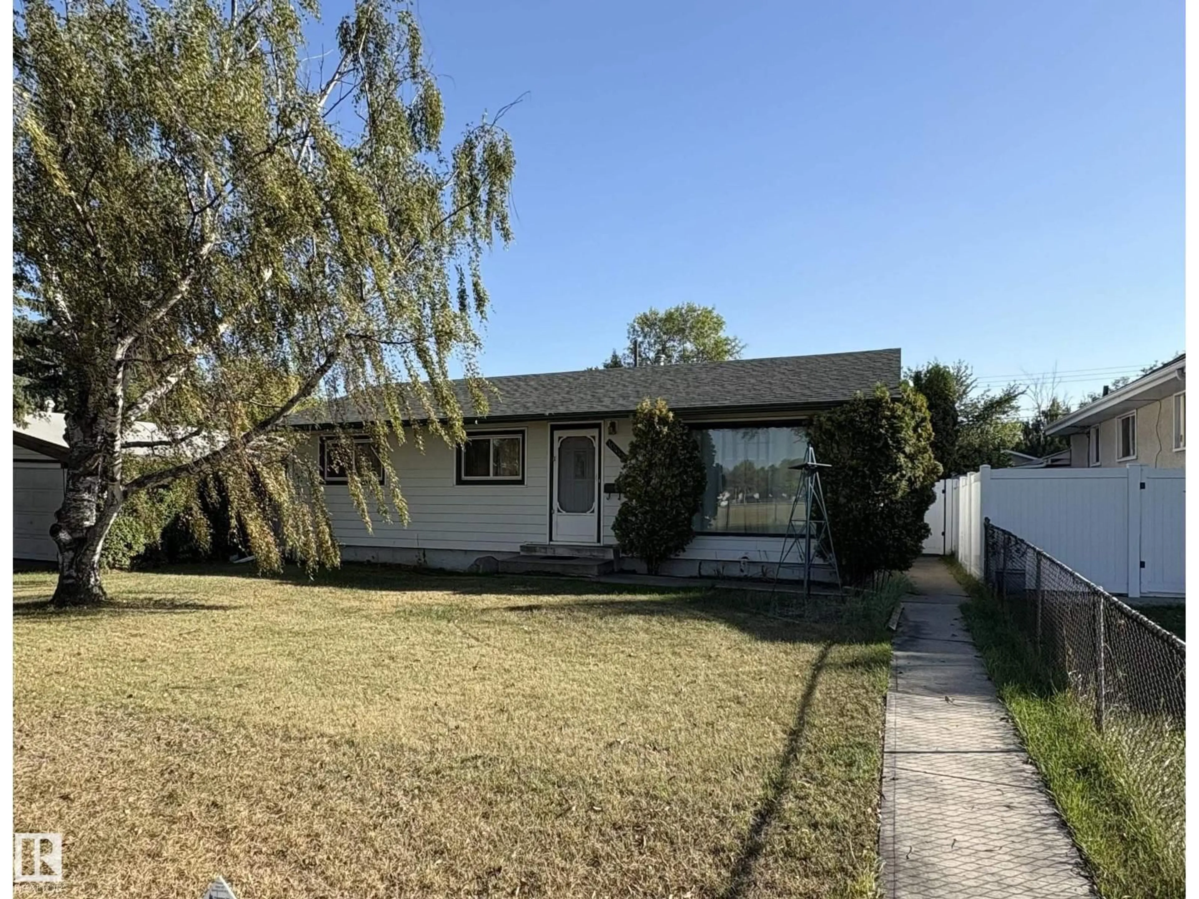Home with vinyl exterior material, street for 10443 129 AV, Edmonton Alberta T5E0L2