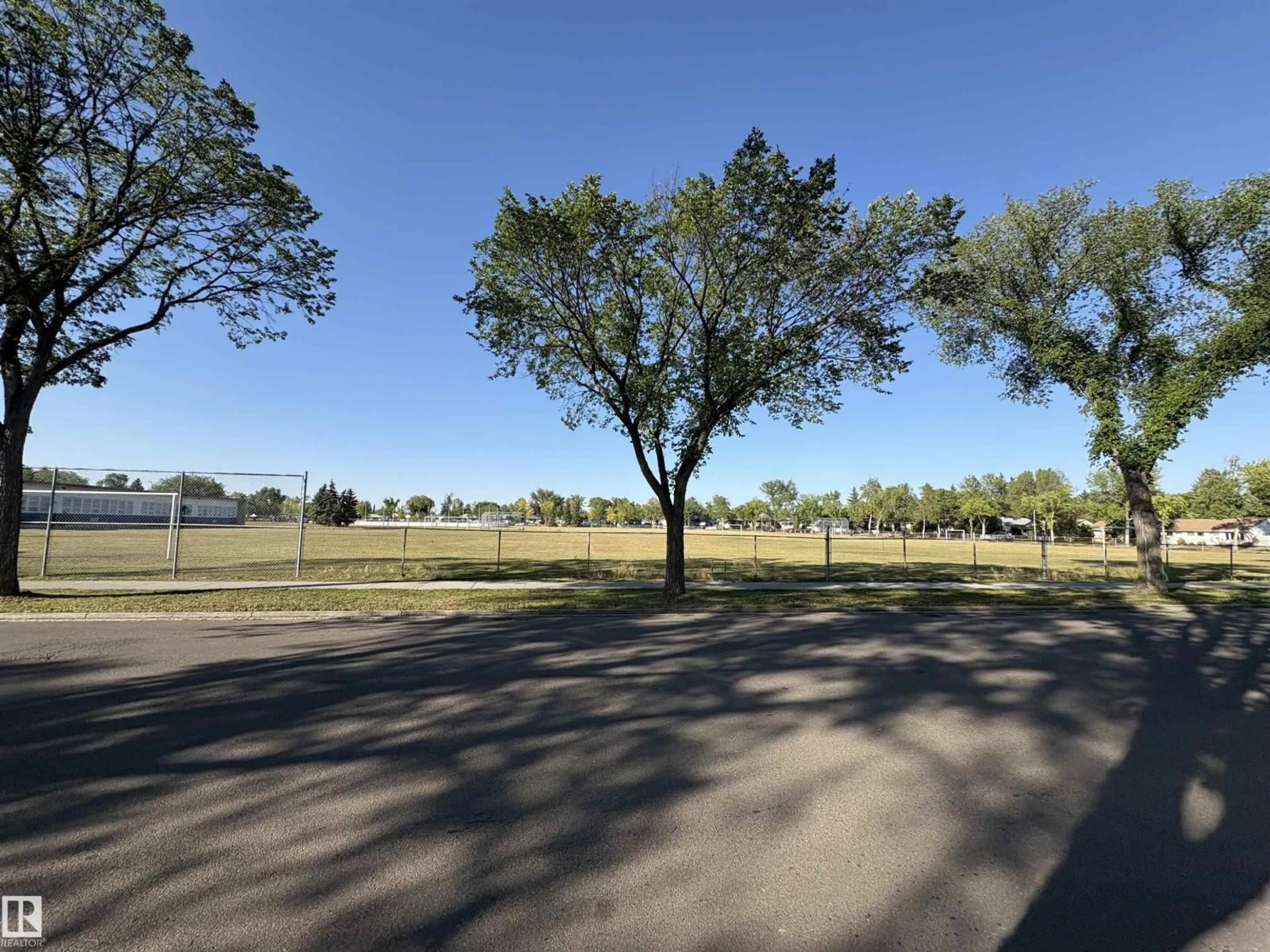 A pic from outside/outdoor area/front of a property/back of a property/a pic from drone, forest/trees view for 10443 129 AV, Edmonton Alberta T5E0L2