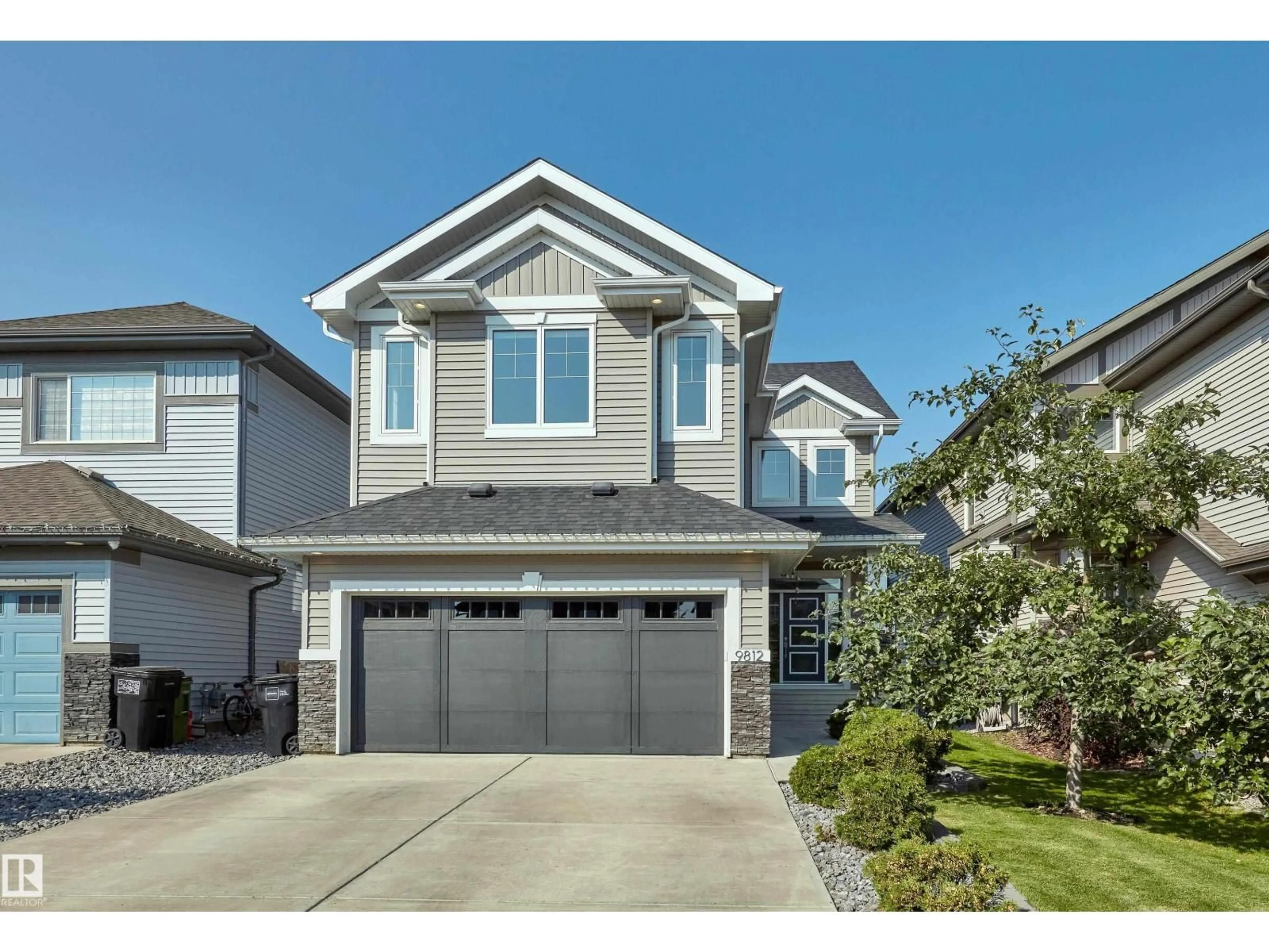 Home with vinyl exterior material, street for NW - 9812 222 ST, Edmonton Alberta T5T7B9