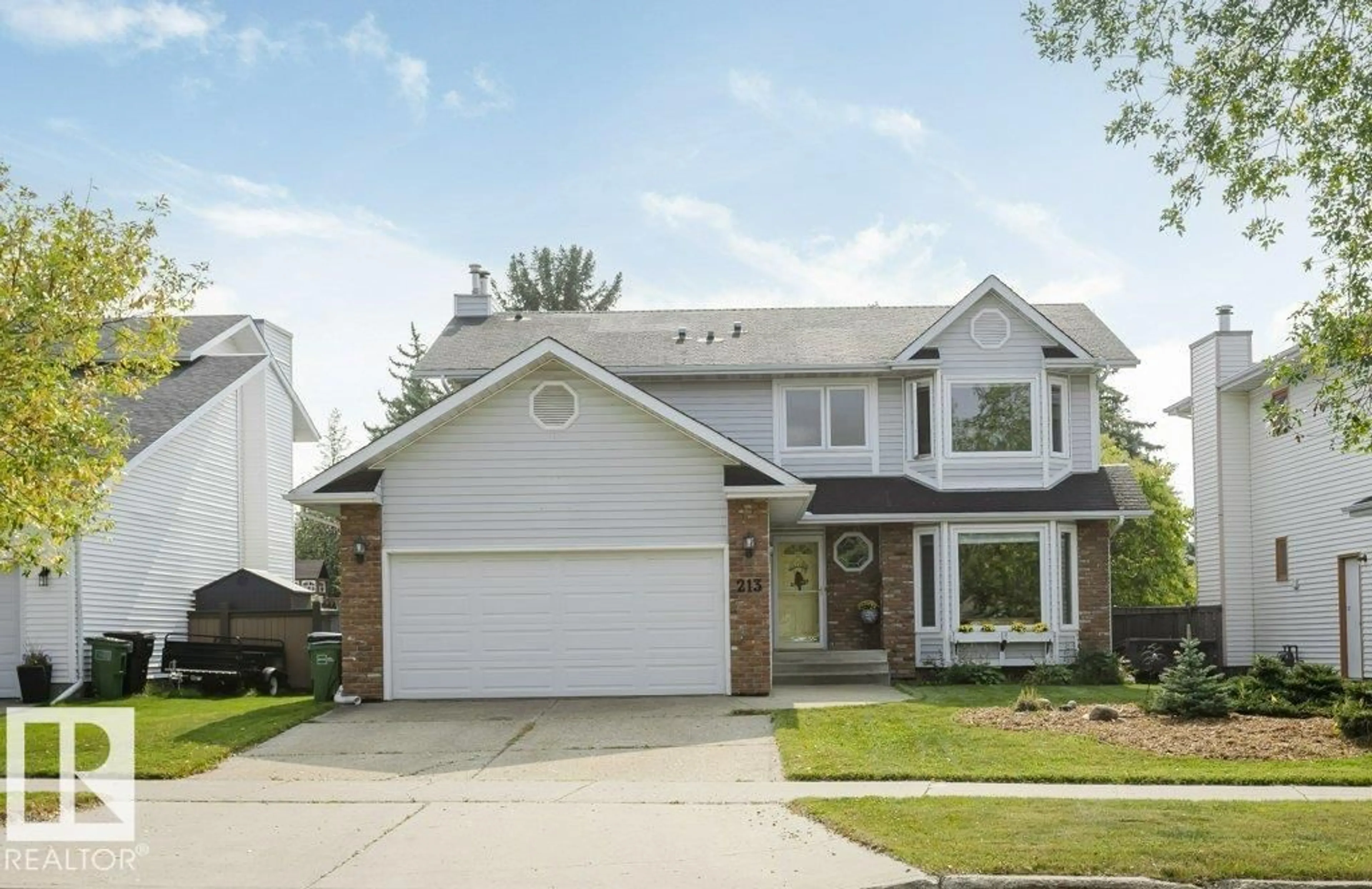 Home with vinyl exterior material, street for 213 BURTON RD, Edmonton Alberta T6R1P8