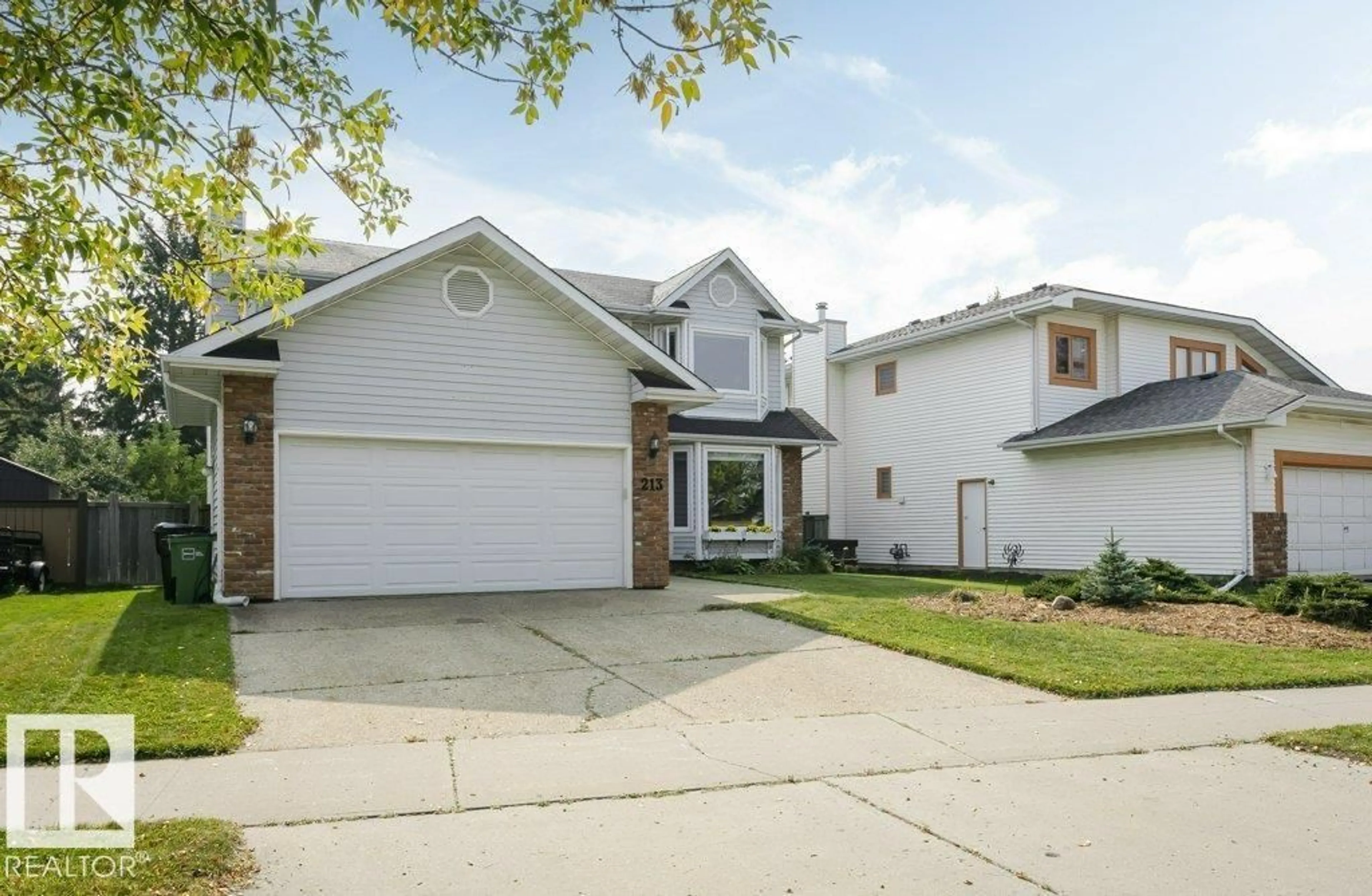 Home with vinyl exterior material, street for 213 BURTON RD, Edmonton Alberta T6R1P8