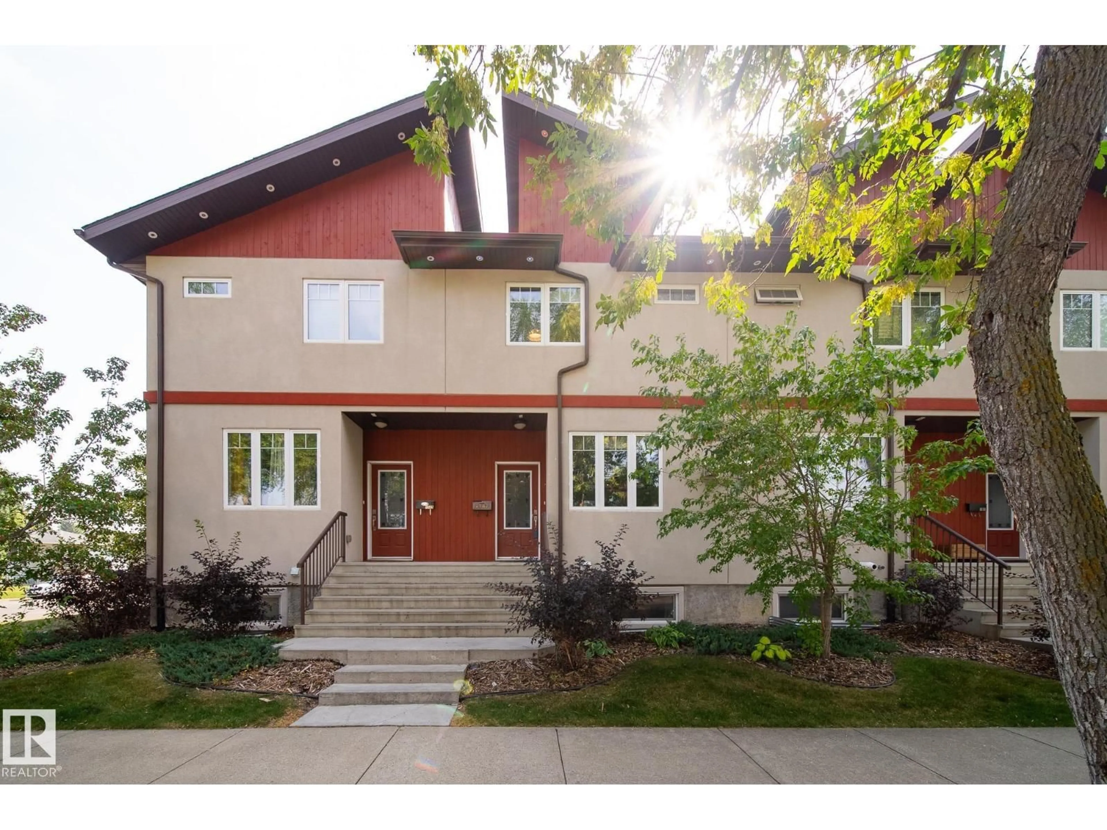 Home with brick exterior material, street for 7907 105 AV NW, Edmonton Alberta T6A3G9