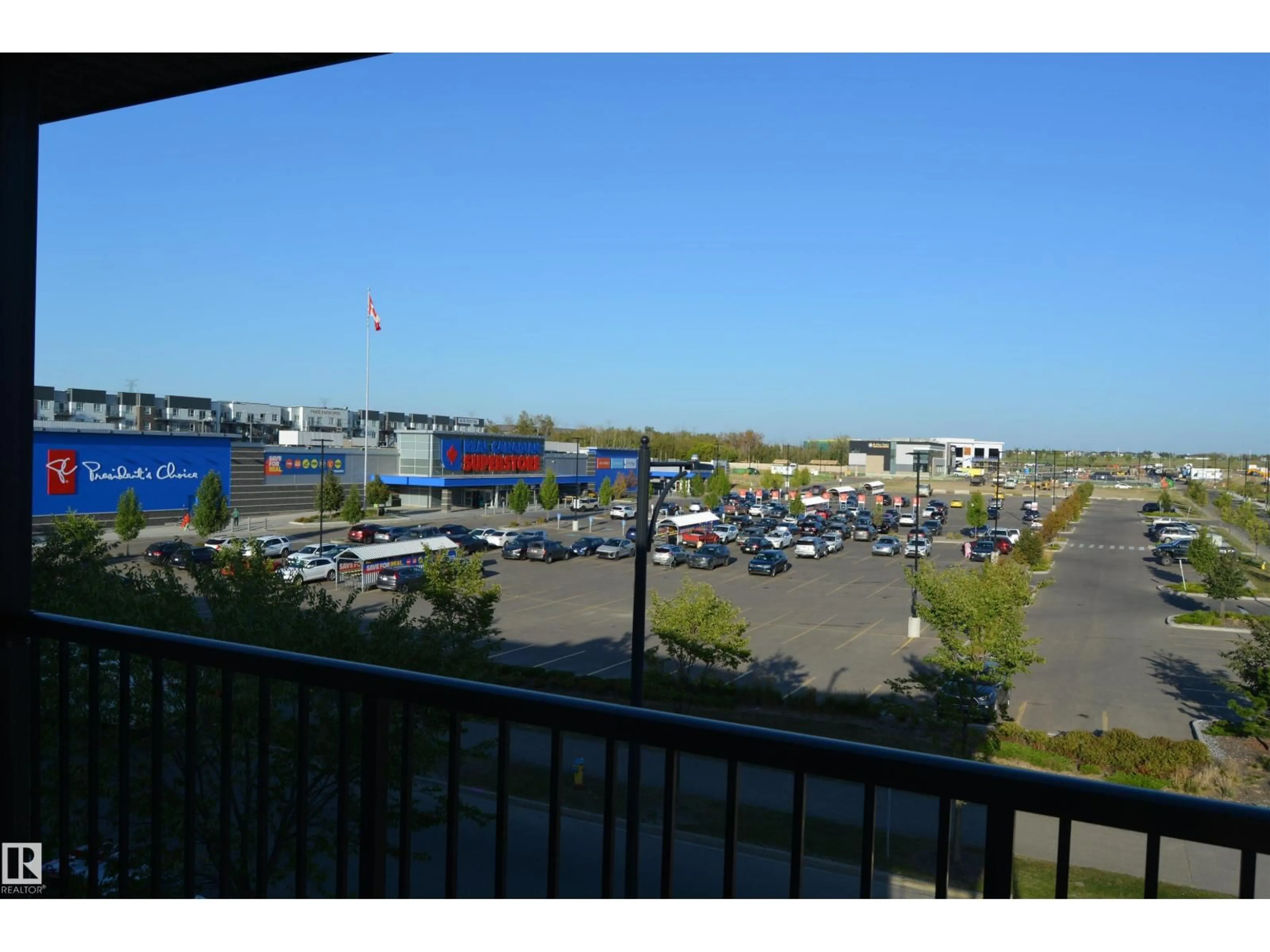Patio, city buildings view from balcony for #408 - 5404 7 AV SW, Edmonton Alberta T6X2K4