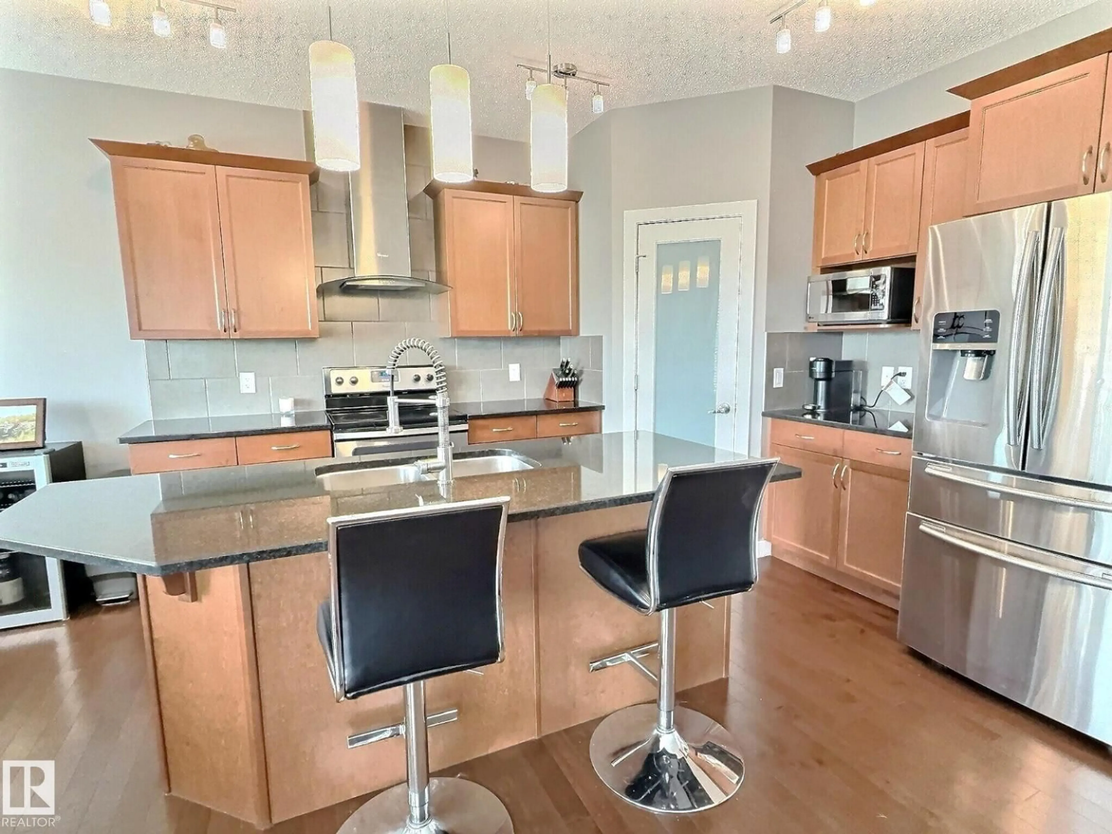 Open concept kitchen, wood/laminate floor for 21703 80 AV, Edmonton Alberta T5T4S2