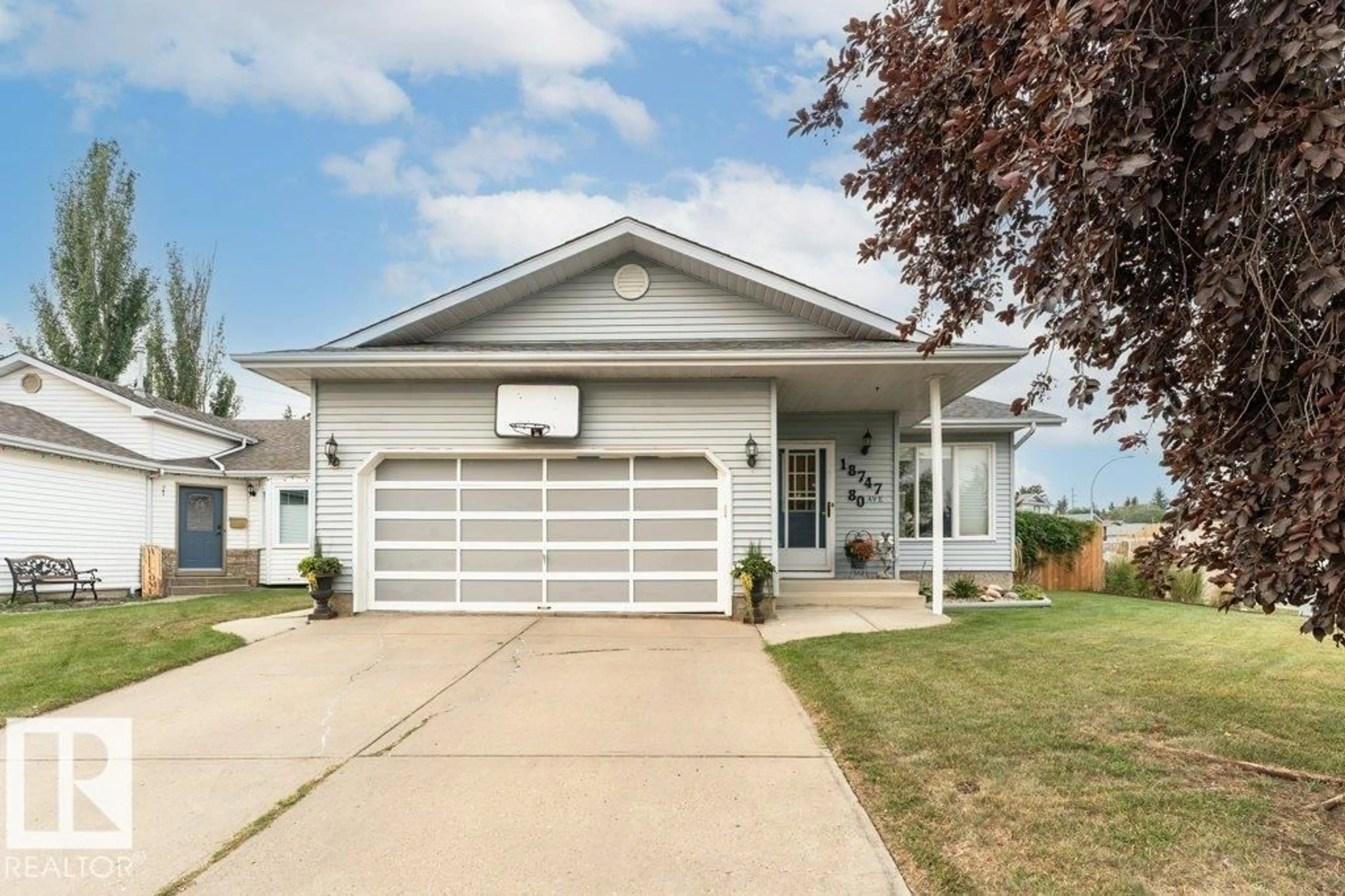 Home with vinyl exterior material, street for 18747 80 AV, Edmonton Alberta T5T5B5