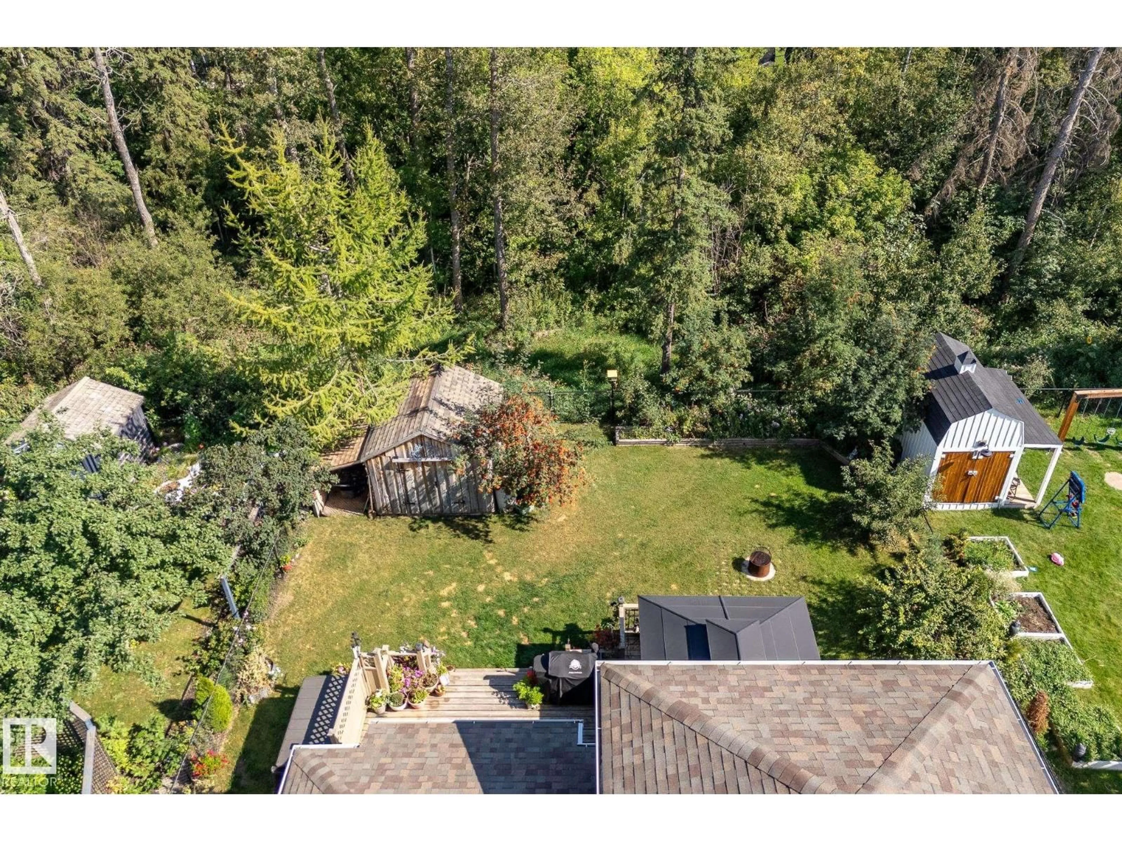 A pic from outside/outdoor area/front of a property/back of a property/a pic from drone, forest/trees view for 4603 42ND STREET, Beaumont Alberta T4X1H1