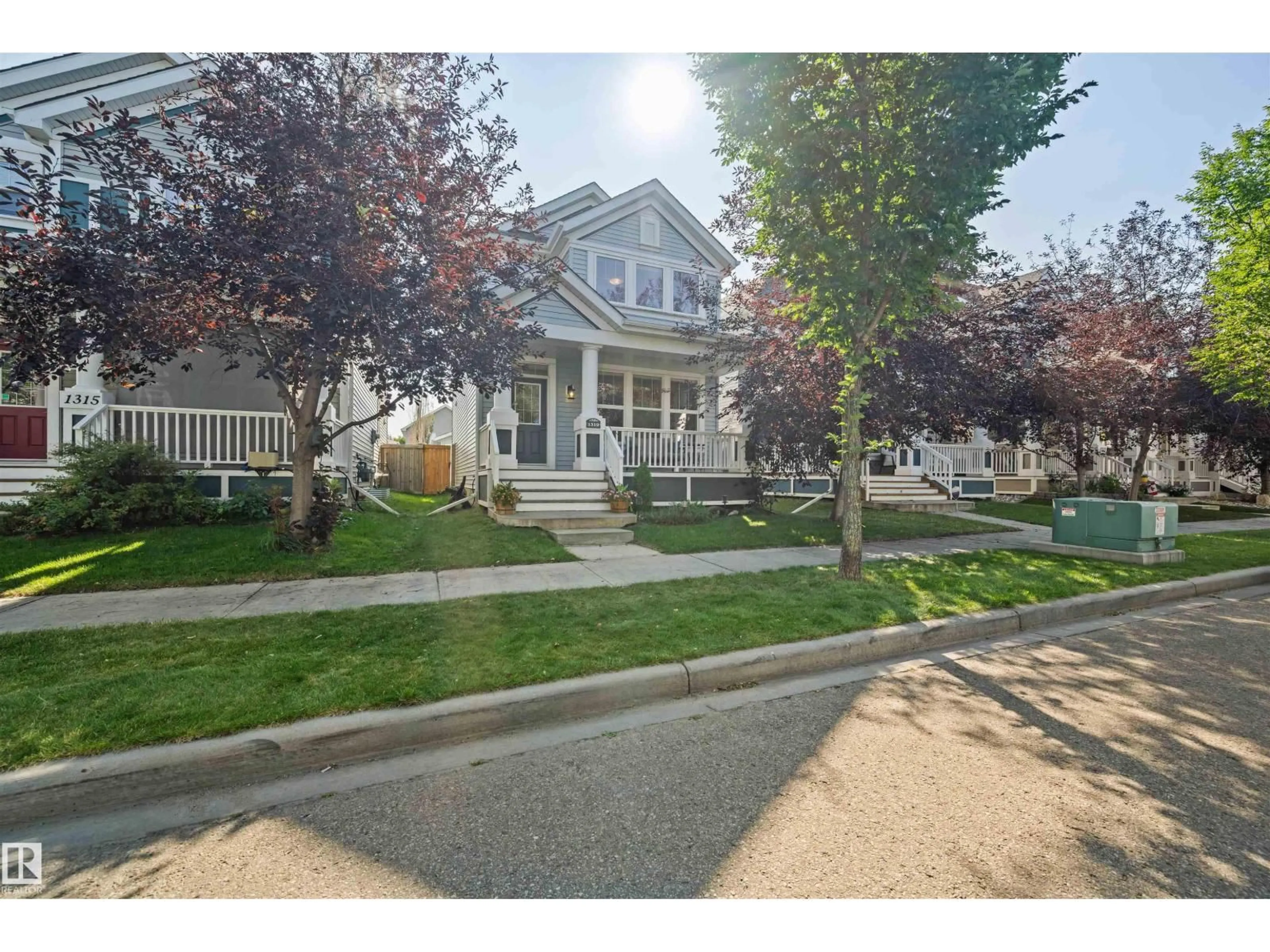 Home with vinyl exterior material, street for 1319 74 ST, Edmonton Alberta T6X0H1