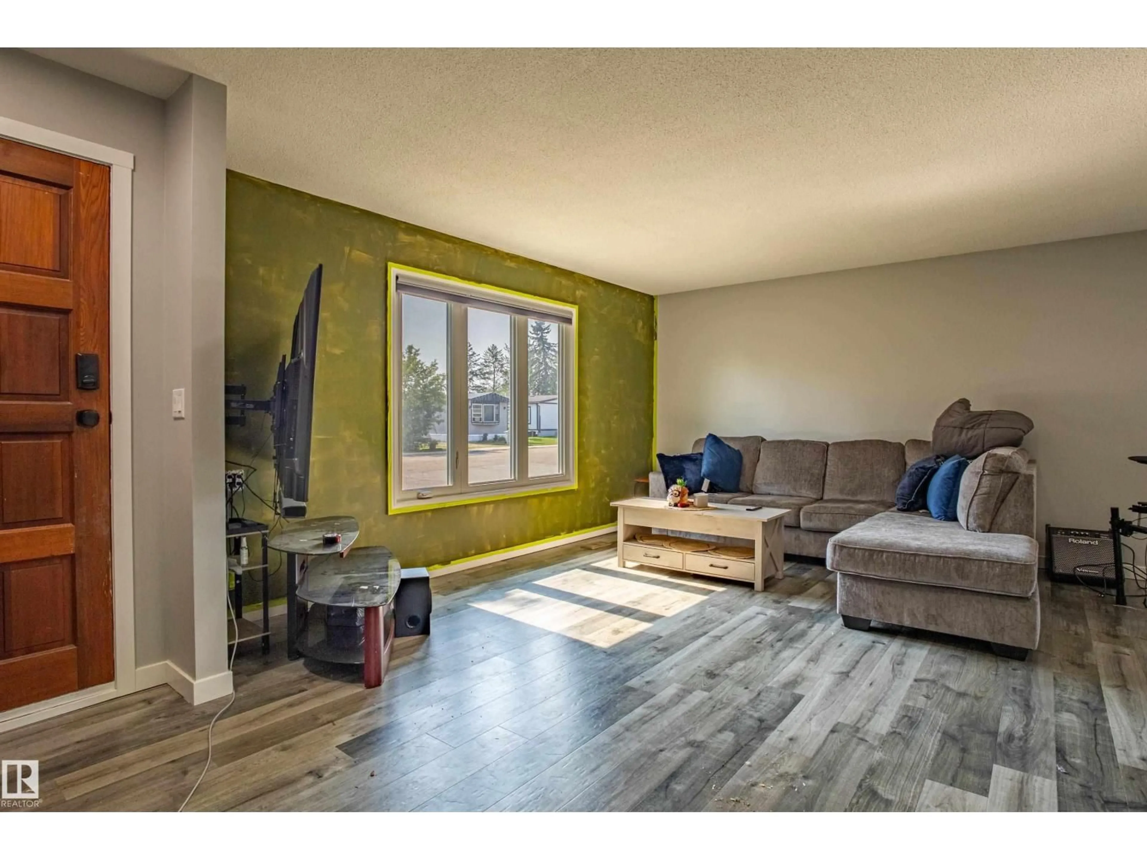 Living room with furniture, wood/laminate floor for 5453 EASTVIEW CR, Redwater Alberta T0A2W0