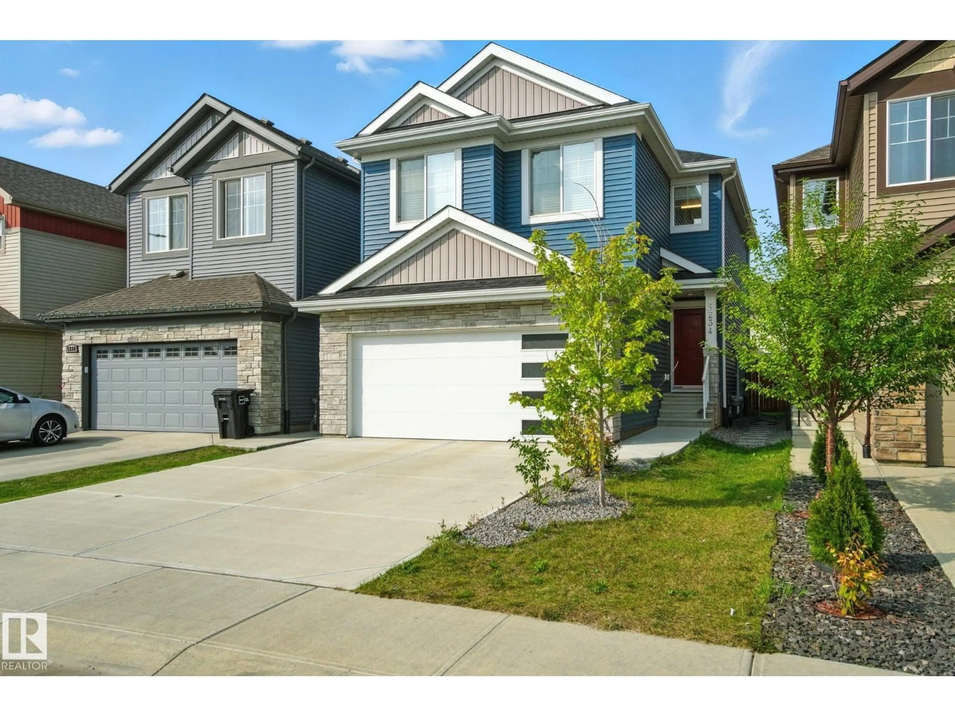 Home with vinyl exterior material, street for 5234 23 AV SW, Edmonton Alberta T6L6Y7