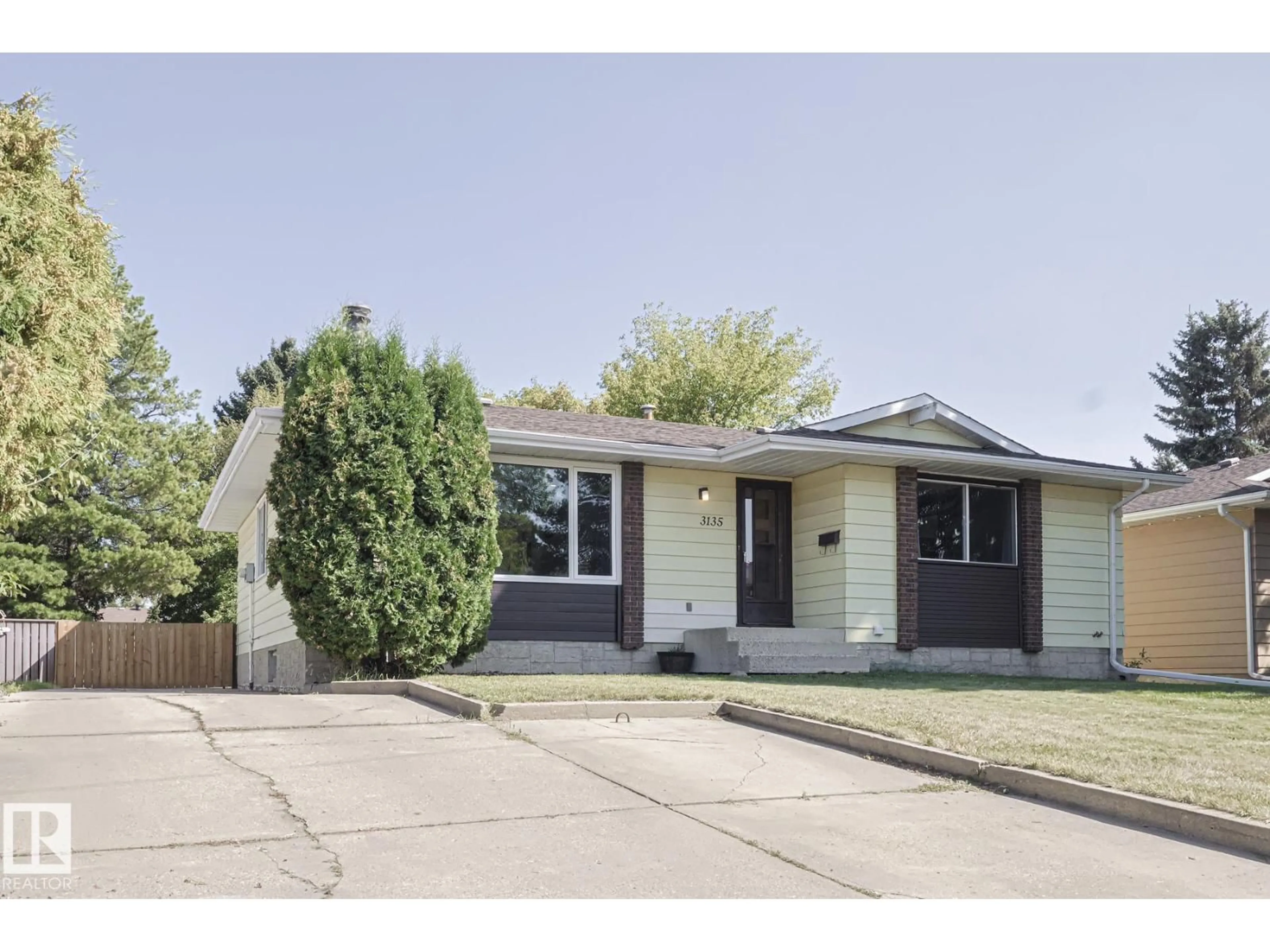 Home with vinyl exterior material, street for 3135 74 ST, Edmonton Alberta T6K1J7