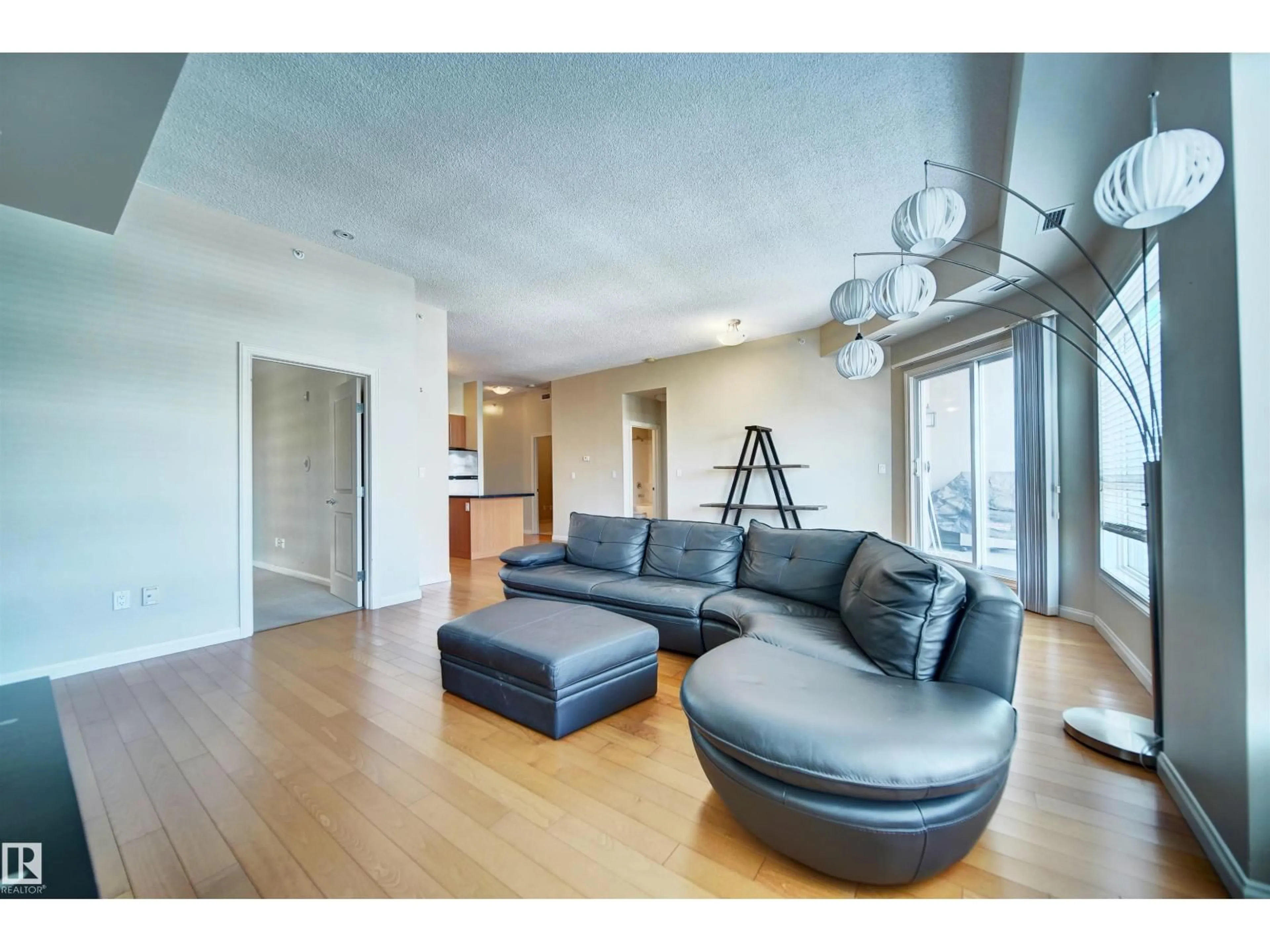 Living room with furniture, wood/laminate floor for #1206 - 9819 104 ST, Edmonton Alberta T5K0Y8