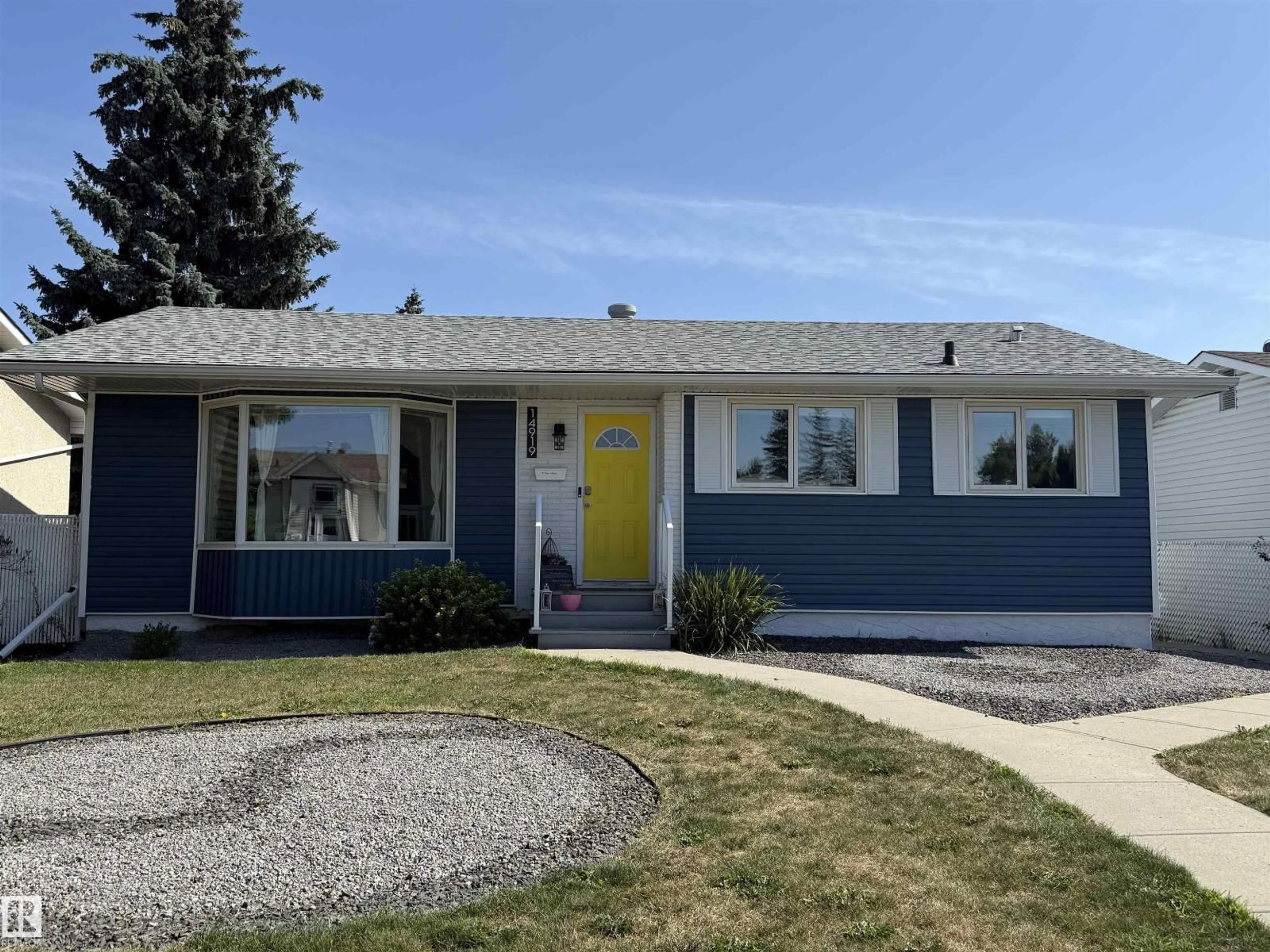 Home with vinyl exterior material, street for 14919 96 ST, Edmonton Alberta T5E4B9