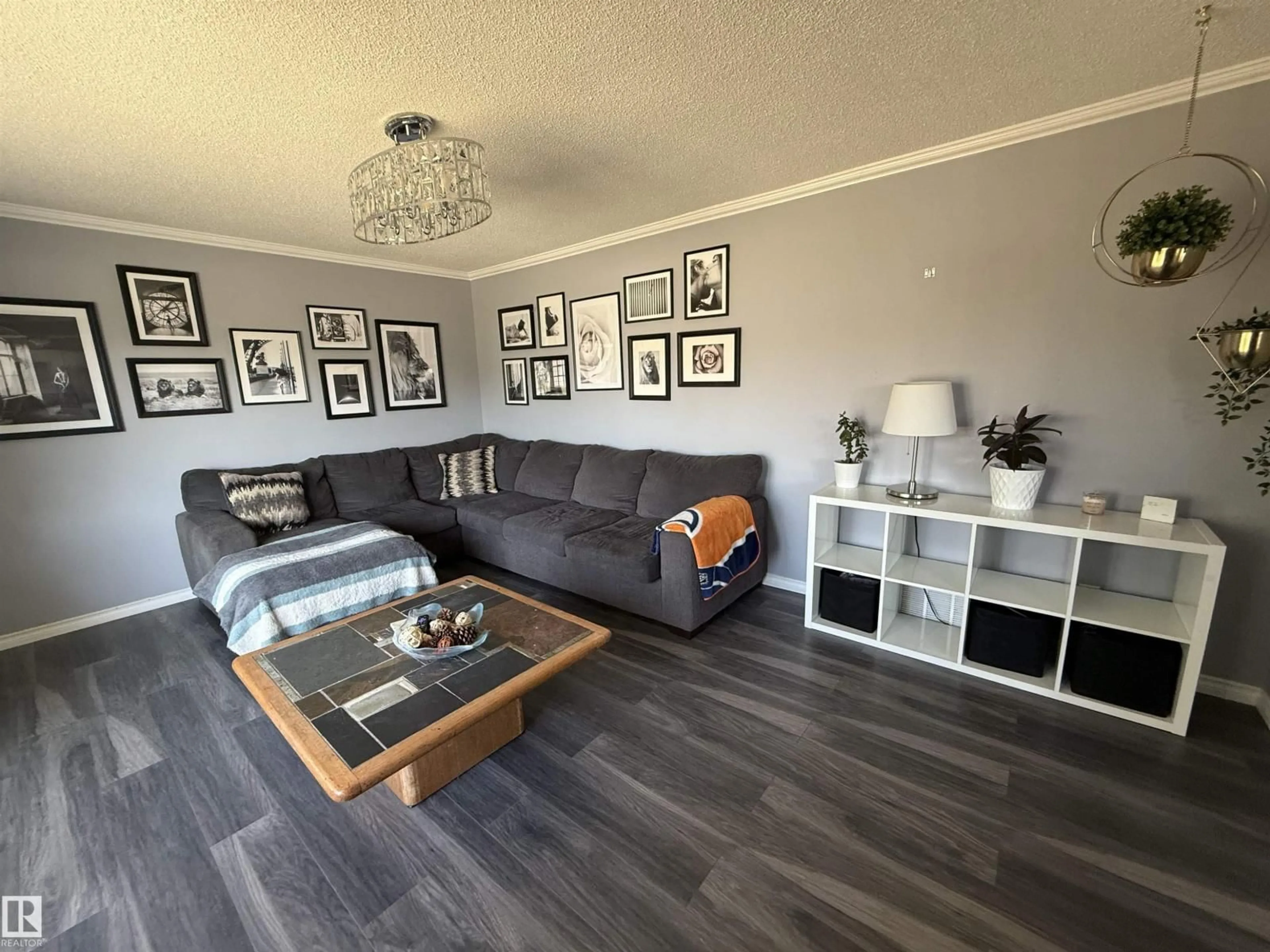 Living room with furniture, wood/laminate floor for 14919 96 ST, Edmonton Alberta T5E4B9