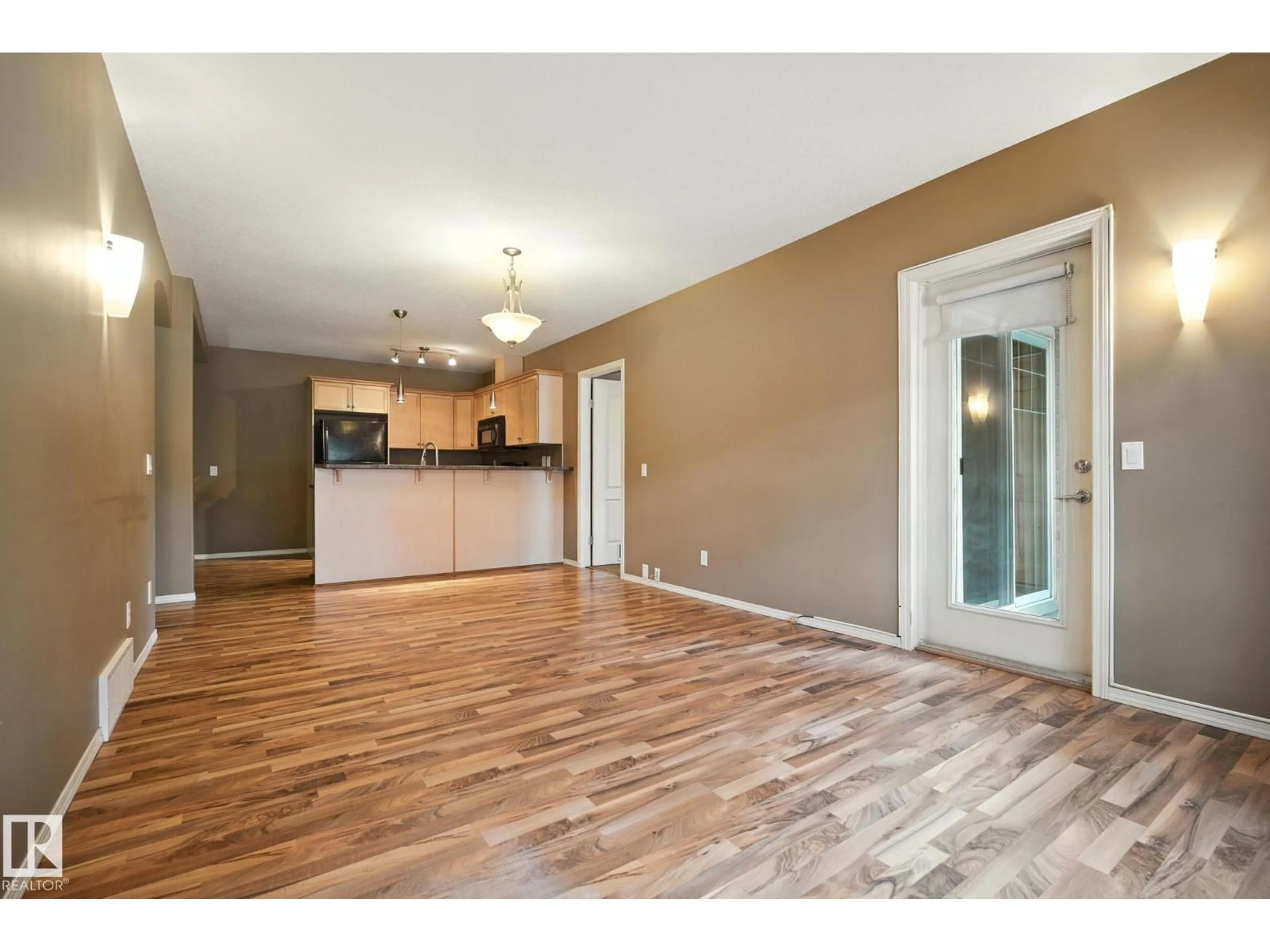 Open concept kitchen, wood/laminate floor for 21 - 671 SILVER BERRY RD, Edmonton Alberta T6T0B7