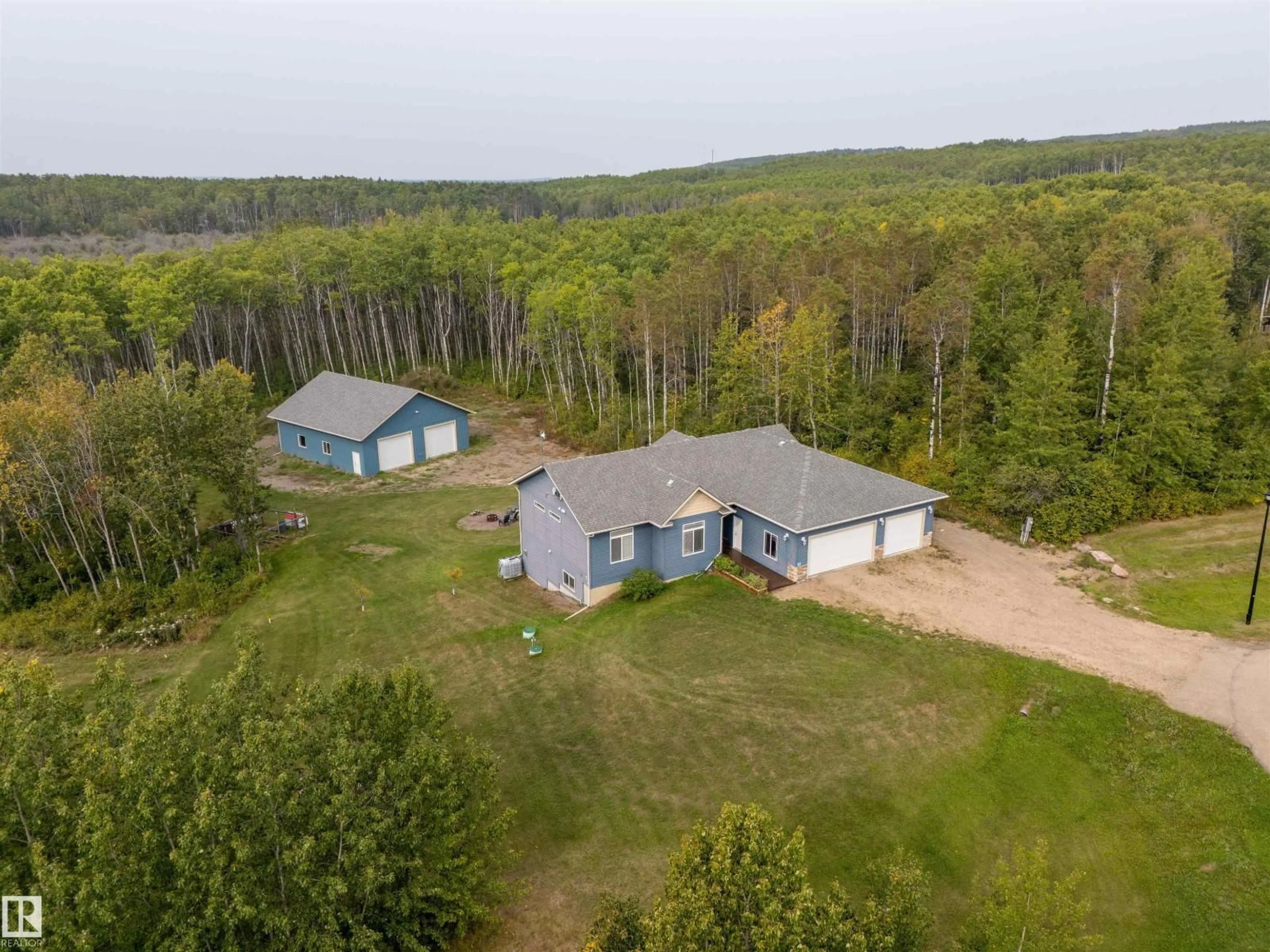 A pic from outside/outdoor area/front of a property/back of a property/a pic from drone, unknown for 102 - 62212 RANGE ROAD 412, Rural Bonnyville M.D. Alberta T0A0T0