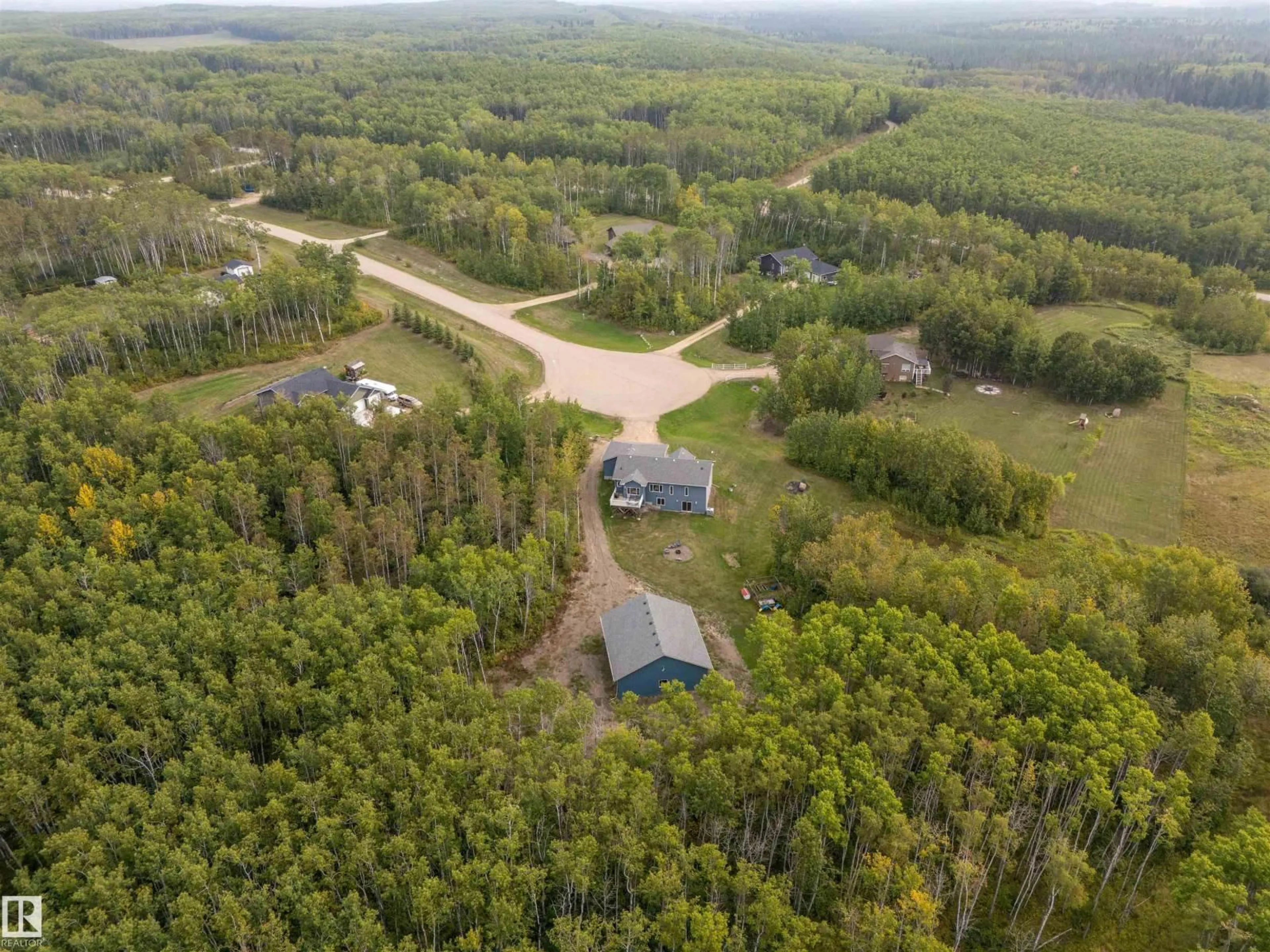 A pic from outside/outdoor area/front of a property/back of a property/a pic from drone, forest/trees view for 102 - 62212 RANGE ROAD 412, Rural Bonnyville M.D. Alberta T0A0T0