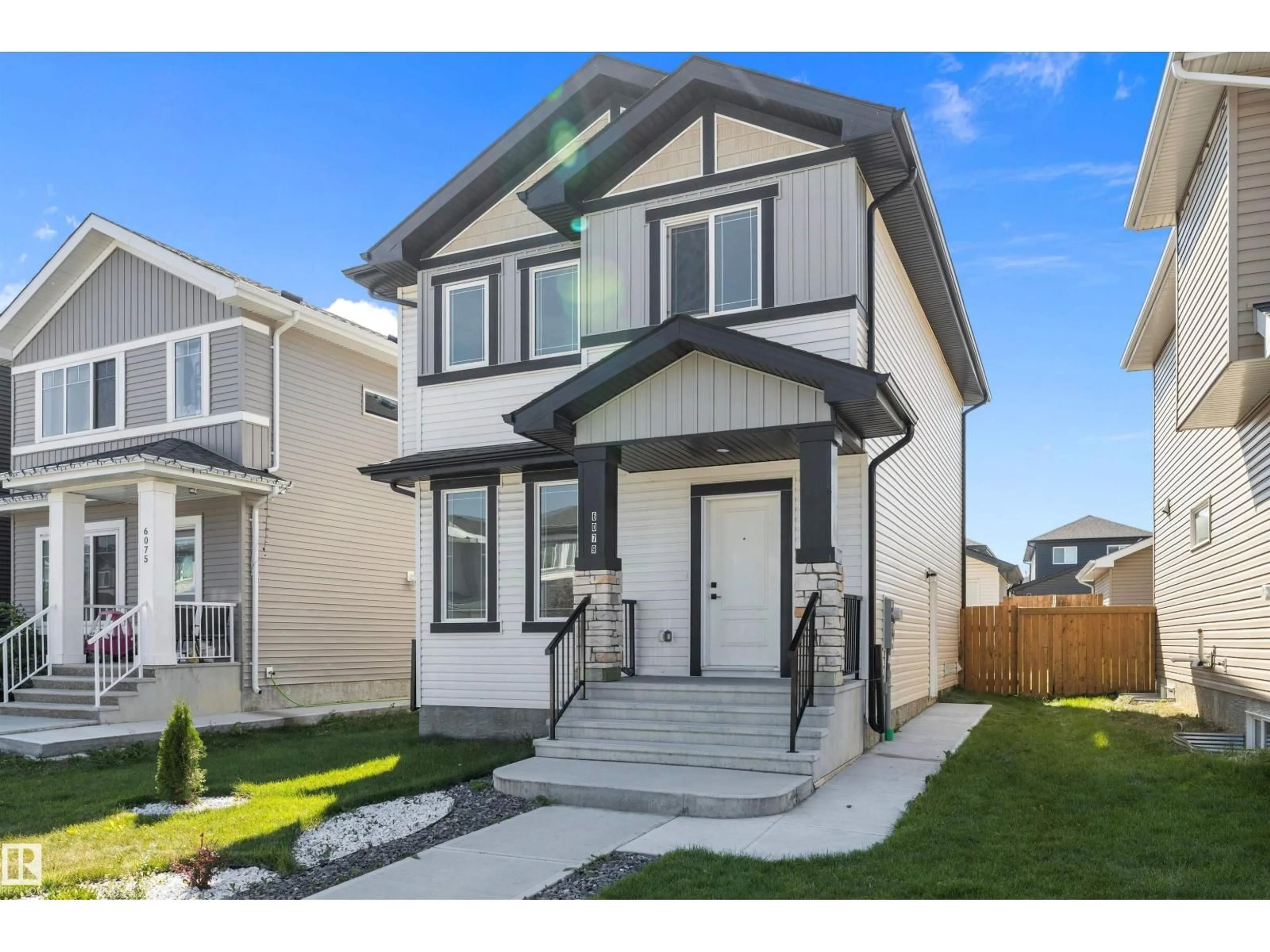Home with vinyl exterior material, street for NW - 6079 180 AV, Edmonton Alberta T5Y3X1