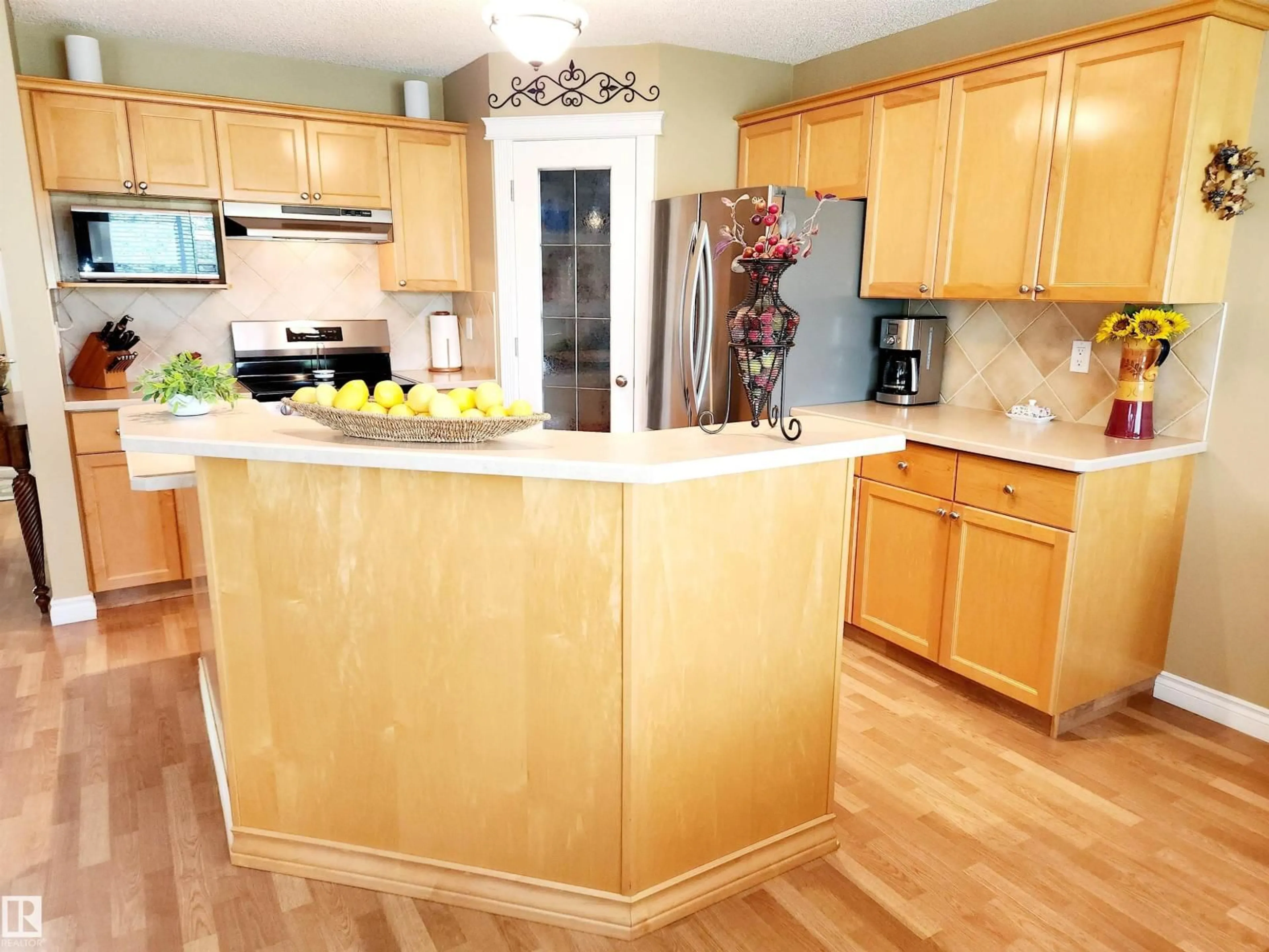 Open concept kitchen, wood/laminate floor for 20 211 BLACKBURN E SW, Edmonton Alberta T6W1C8
