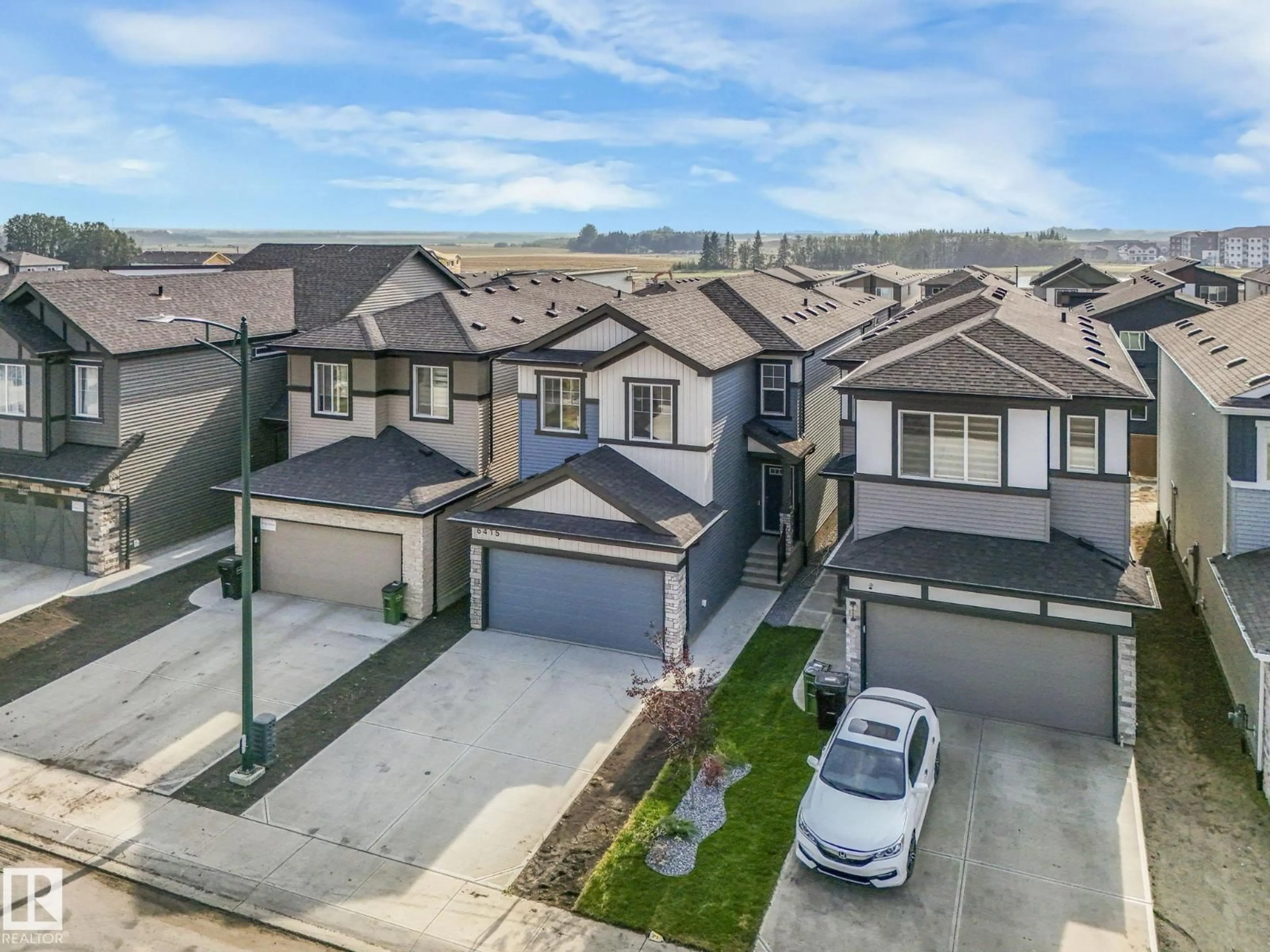 A pic from outside/outdoor area/front of a property/back of a property/a pic from drone, street for SW - 6415 27 AV, Edmonton Alberta T6X3G5