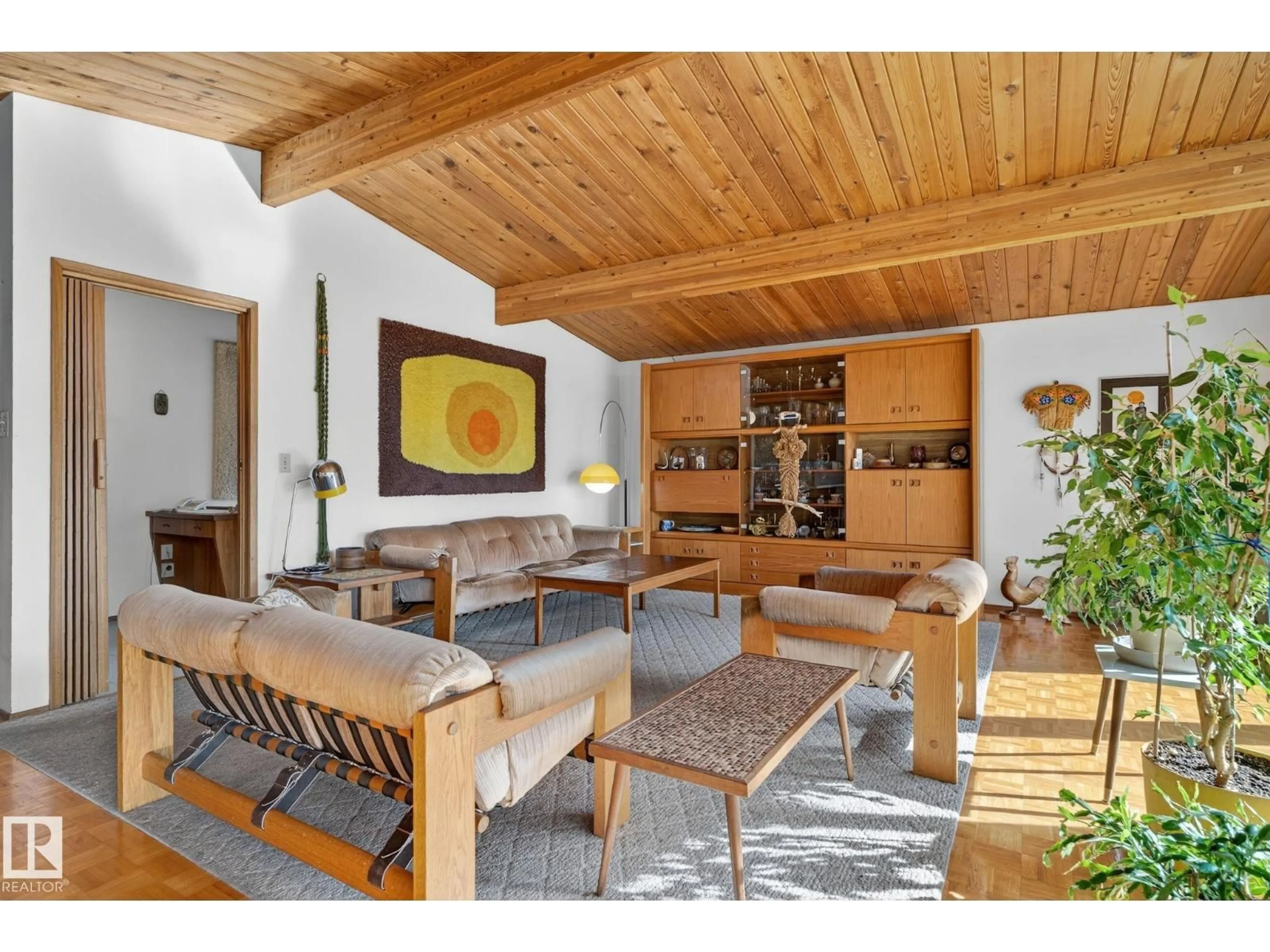 Living room with furniture, wood/laminate floor for 9937 82 ST, Edmonton Alberta T6A3L9