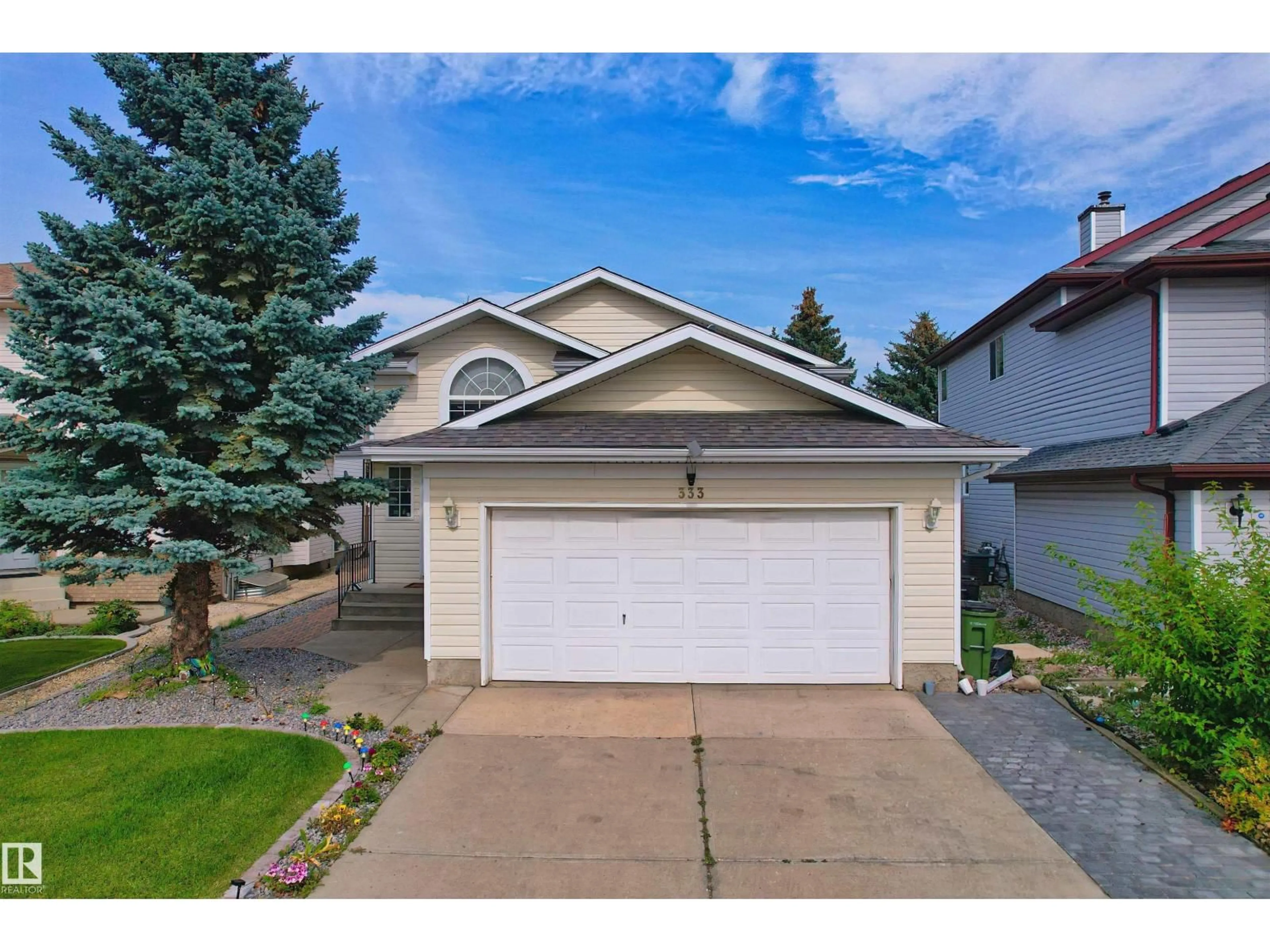Home with vinyl exterior material, street for 333 DECHENE WY, Edmonton Alberta T6M2M6