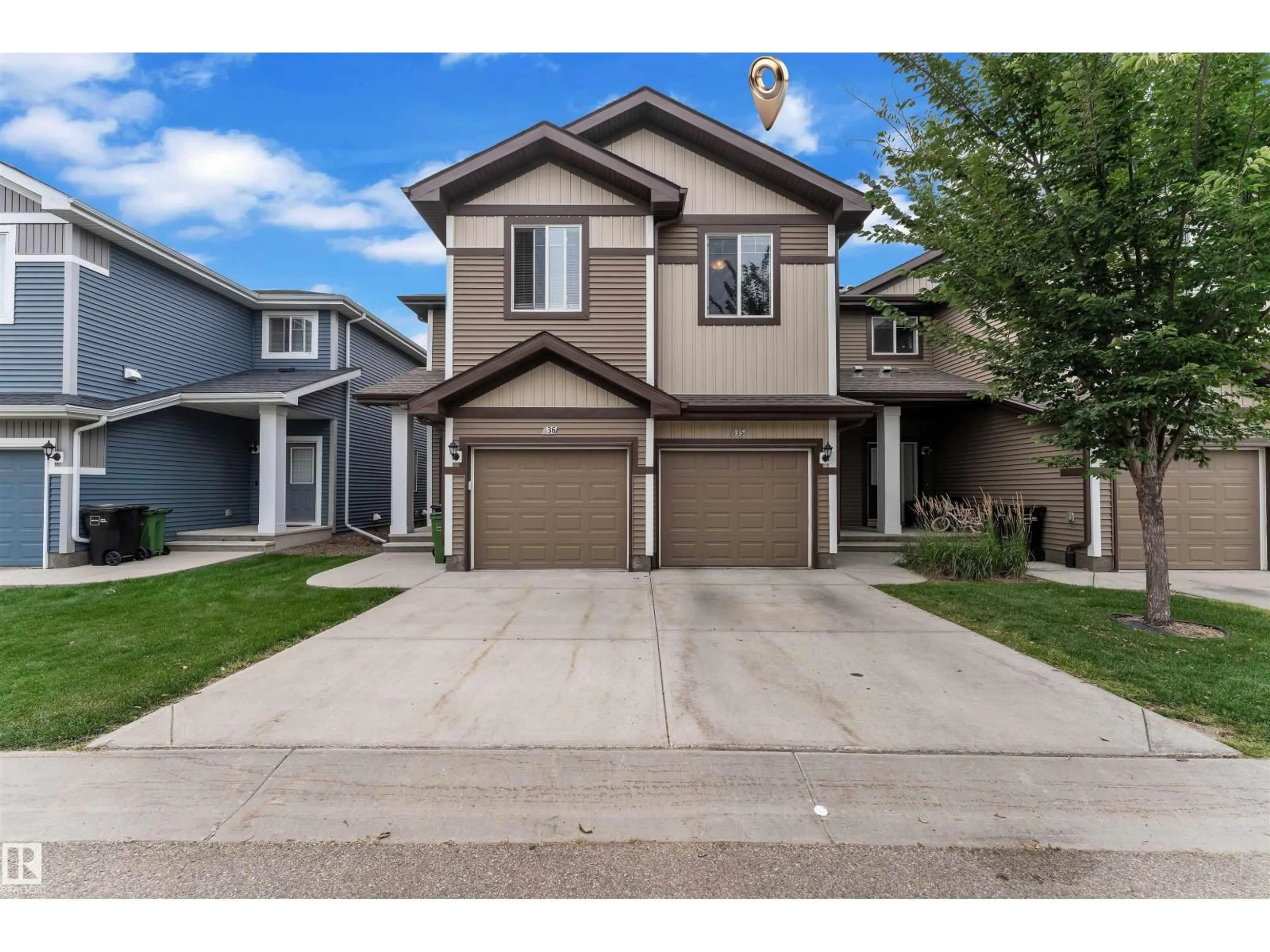 Home with vinyl exterior material, street for 8209 - 35 217 ST NW, Edmonton Alberta T5T6Z4