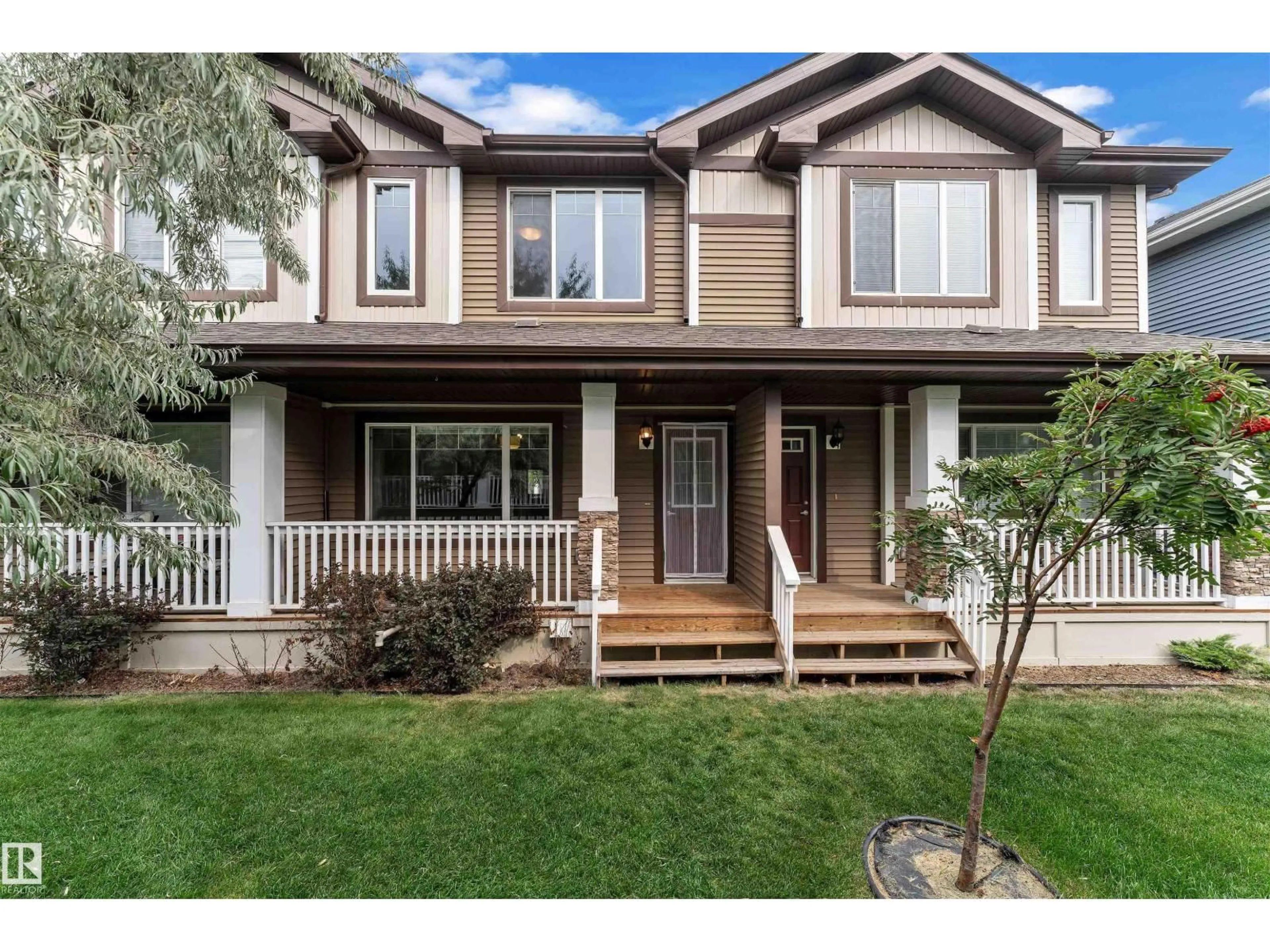 Home with vinyl exterior material, street for 8209 - 35 217 ST NW, Edmonton Alberta T5T6Z4