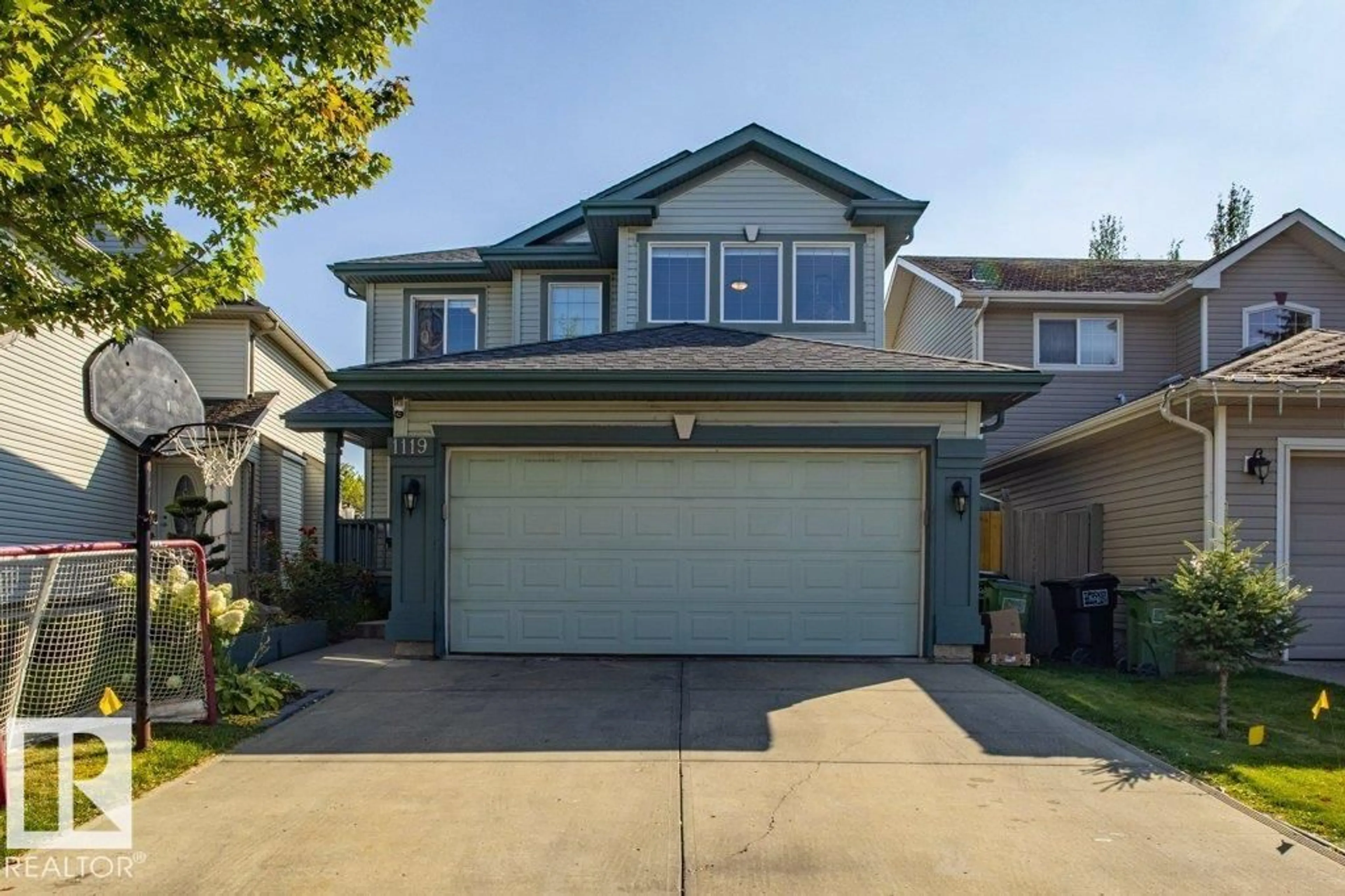 Home with vinyl exterior material, street for SW - 1119 114 ST, Edmonton Alberta T6W1P6