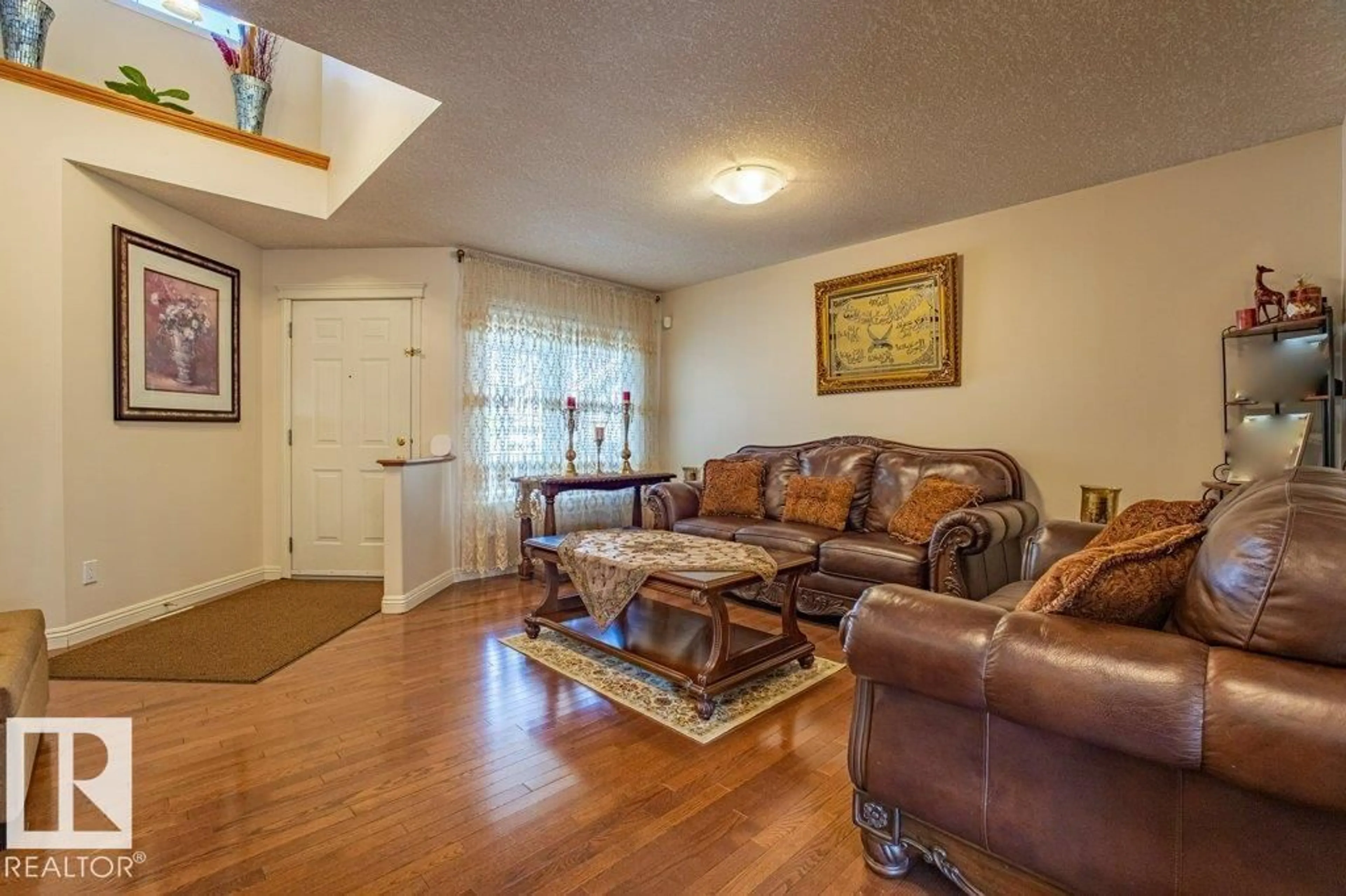 Living room with furniture, wood/laminate floor for SW - 1119 114 ST, Edmonton Alberta T6W1P6