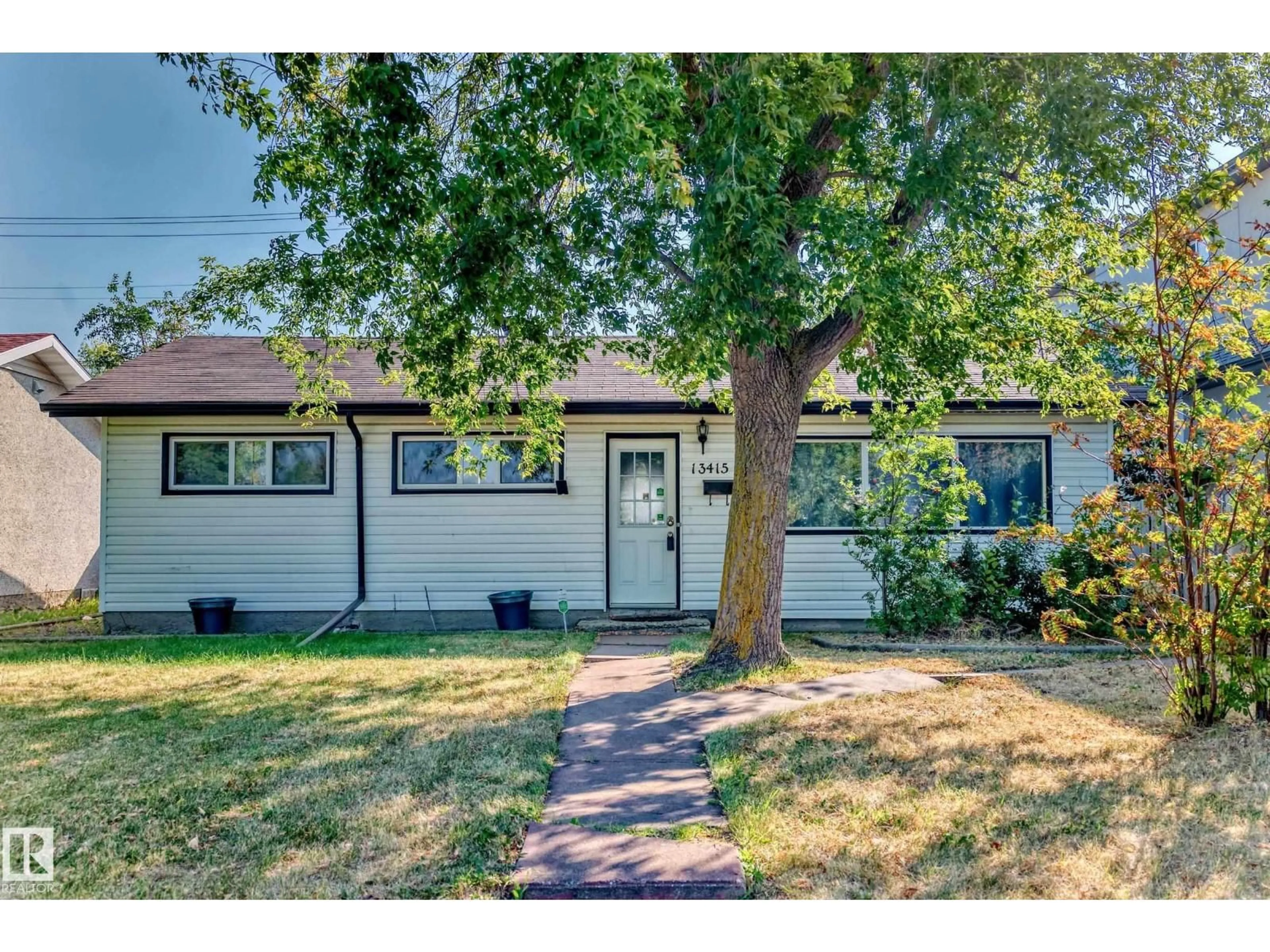 Home with vinyl exterior material, street for NW - 13415 109 ST, Edmonton Alberta T5E4Y6