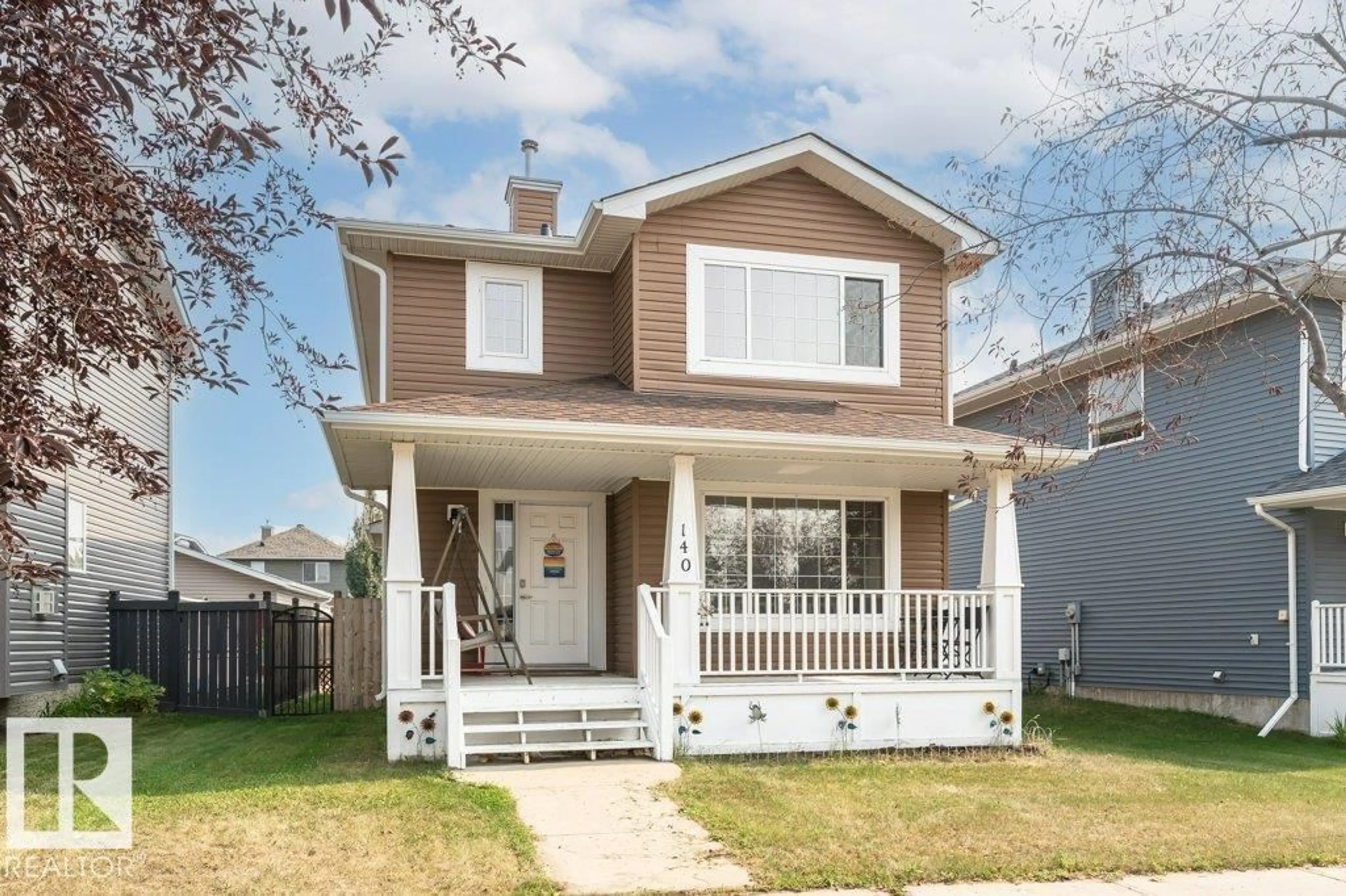 Home with vinyl exterior material, street for 140 WESTWOOD LN, Fort Saskatchewan Alberta T8L4N7