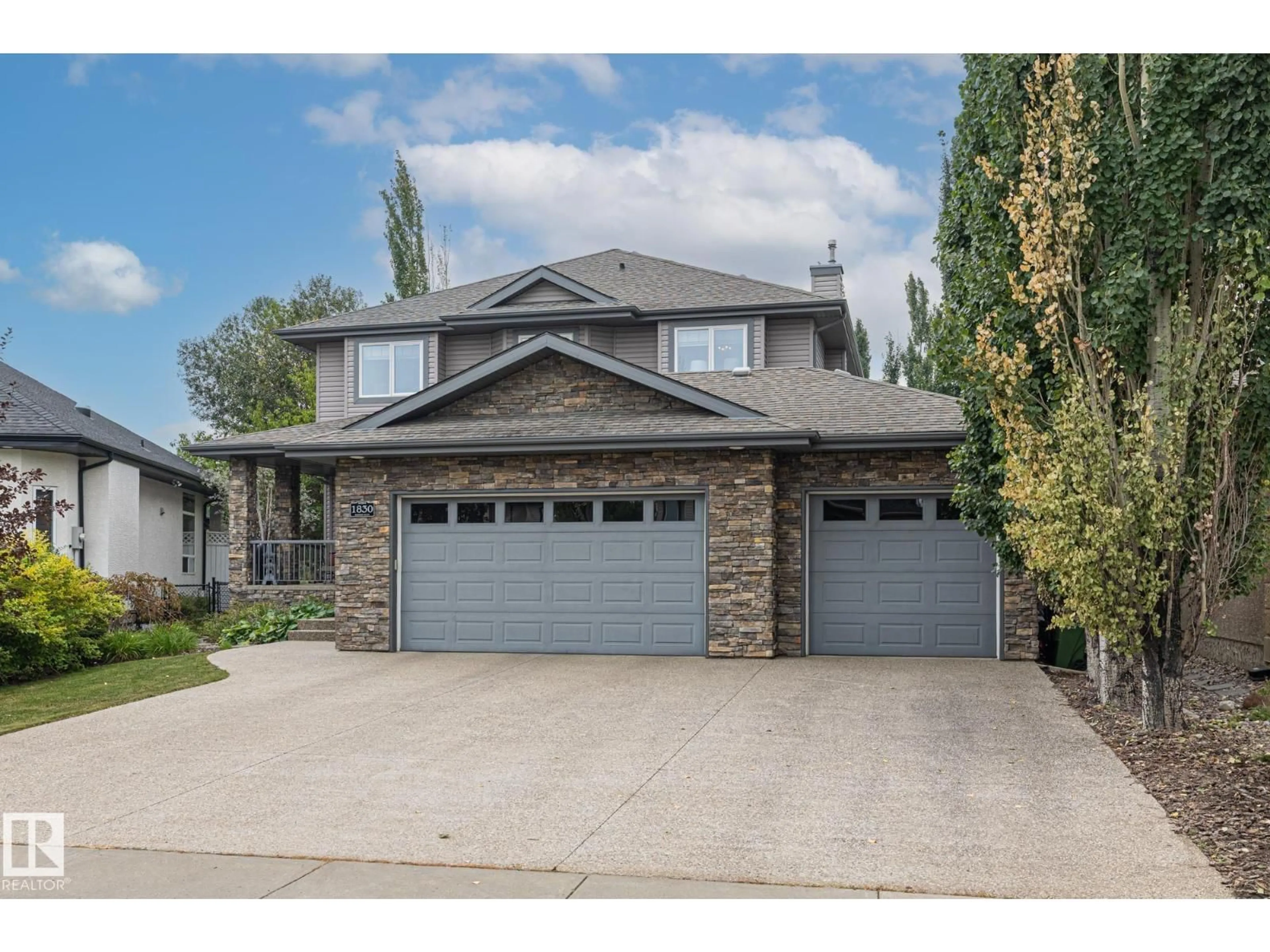 Home with vinyl exterior material, street for 1830 BOWMAN PT, Edmonton Alberta T6W1P7