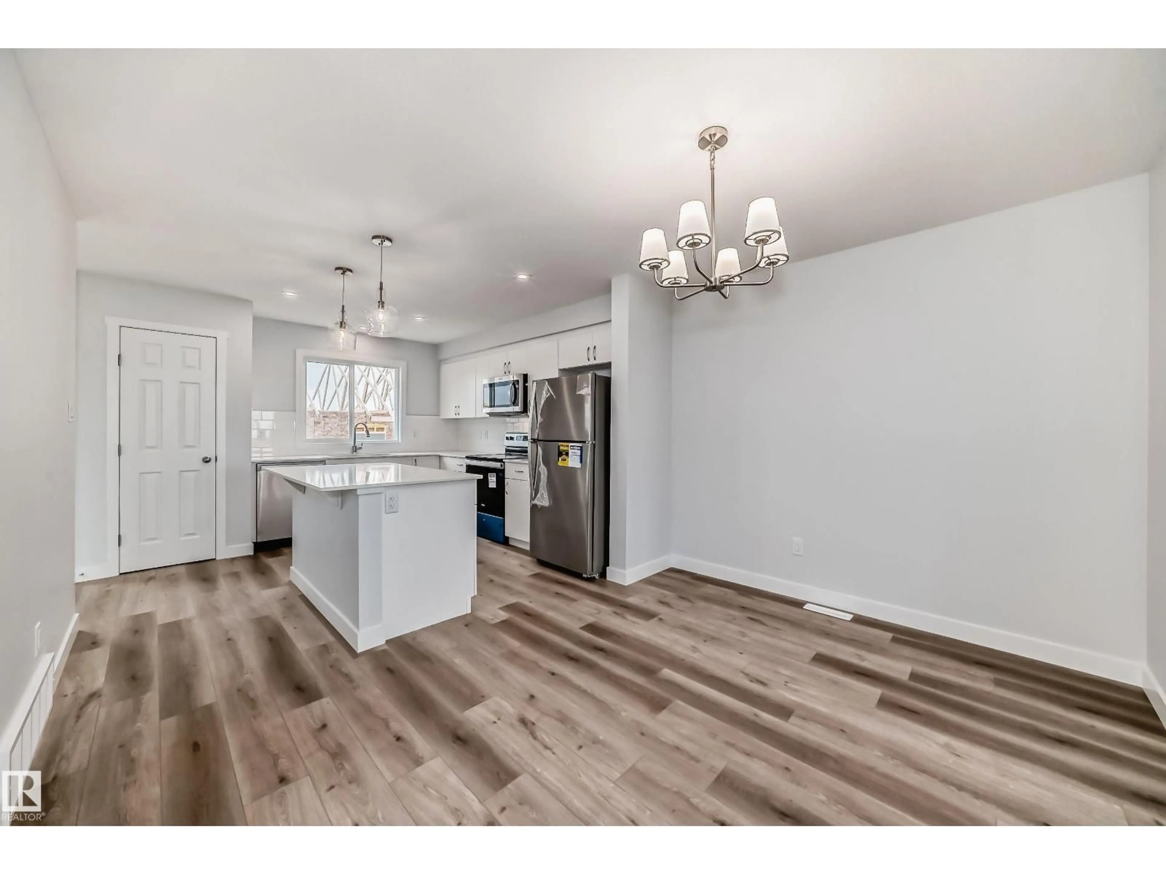 Open concept kitchen, wood/laminate floor for 2 ELLIOT WD, Fort Saskatchewan Alberta T8L0K5