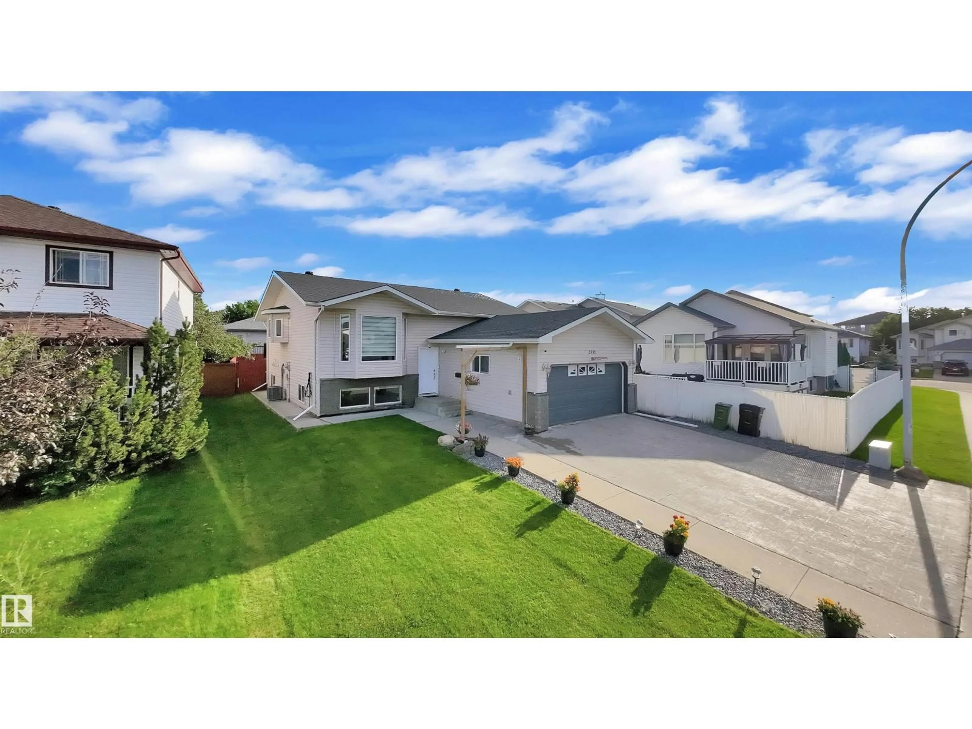 A pic from outside/outdoor area/front of a property/back of a property/a pic from drone, street for 2931 151A AV, Edmonton Alberta T5Y2Y5
