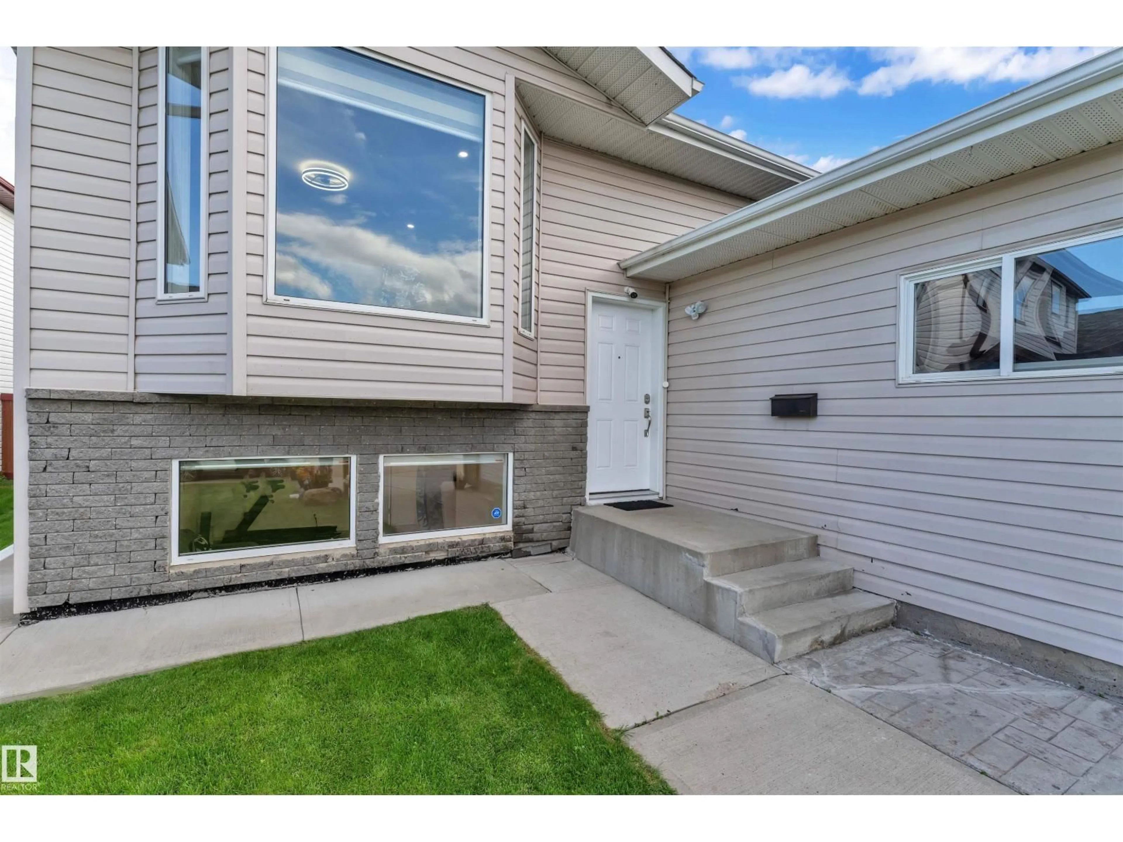 Home with vinyl exterior material, street for 2931 151A AV, Edmonton Alberta T5Y2Y5