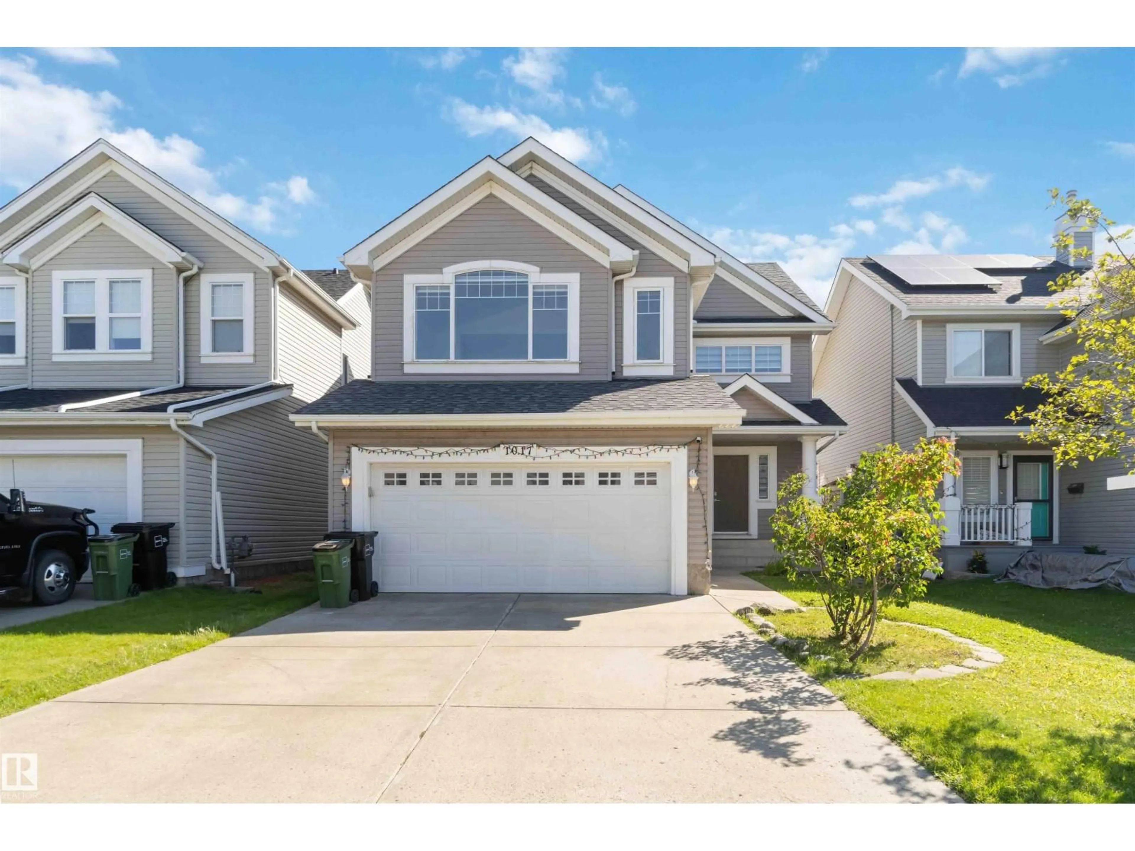 Home with vinyl exterior material, street for 1017 82 ST, Edmonton Alberta T6X1E4