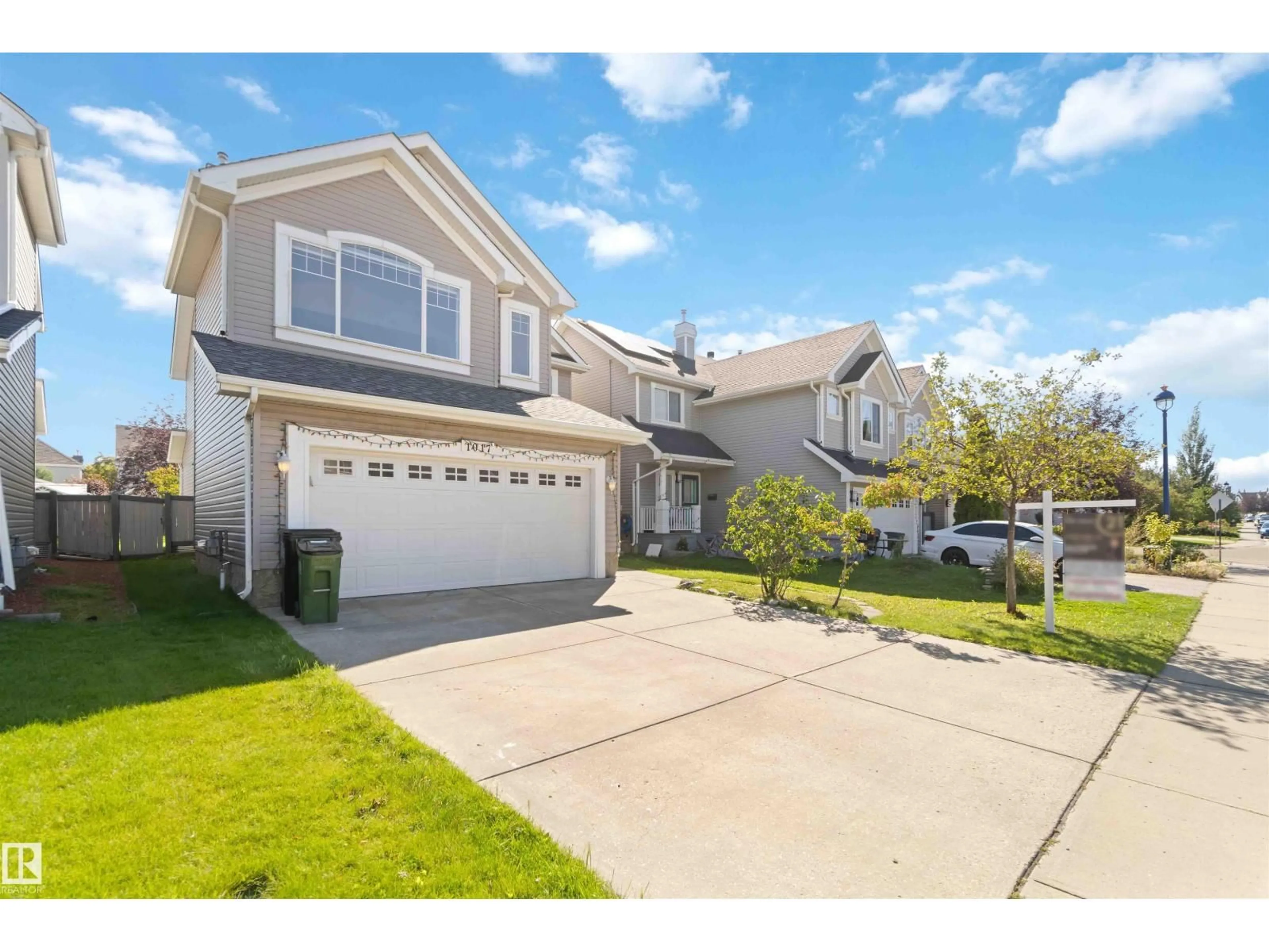 Home with vinyl exterior material, street for 1017 82 ST, Edmonton Alberta T6X1E4