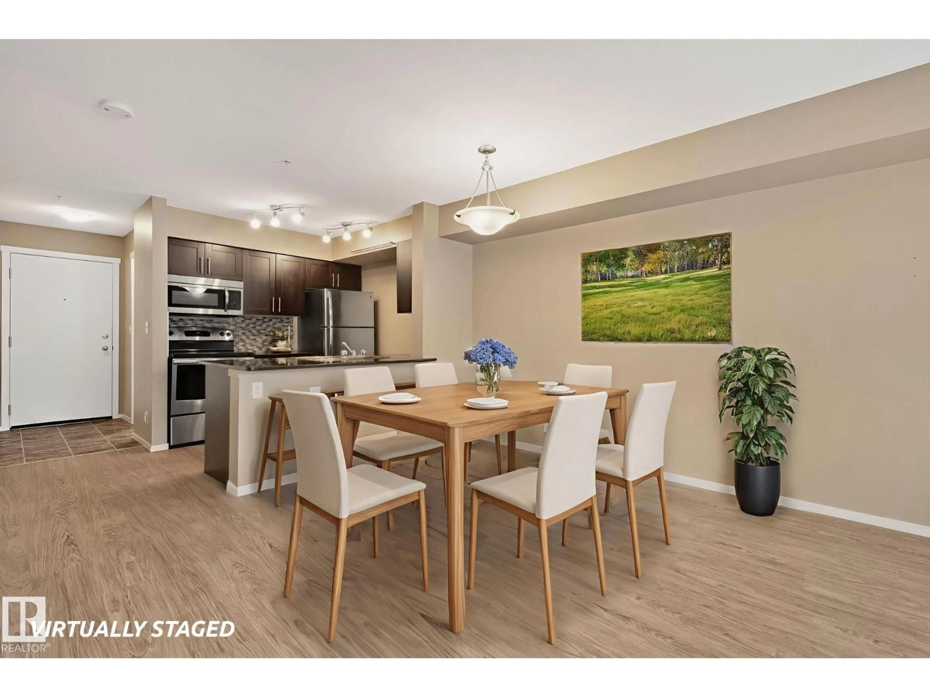 Open concept kitchen, wood/laminate floor for #132 - 3315 JAMES MOWATT TR, Edmonton Alberta T6W3L6