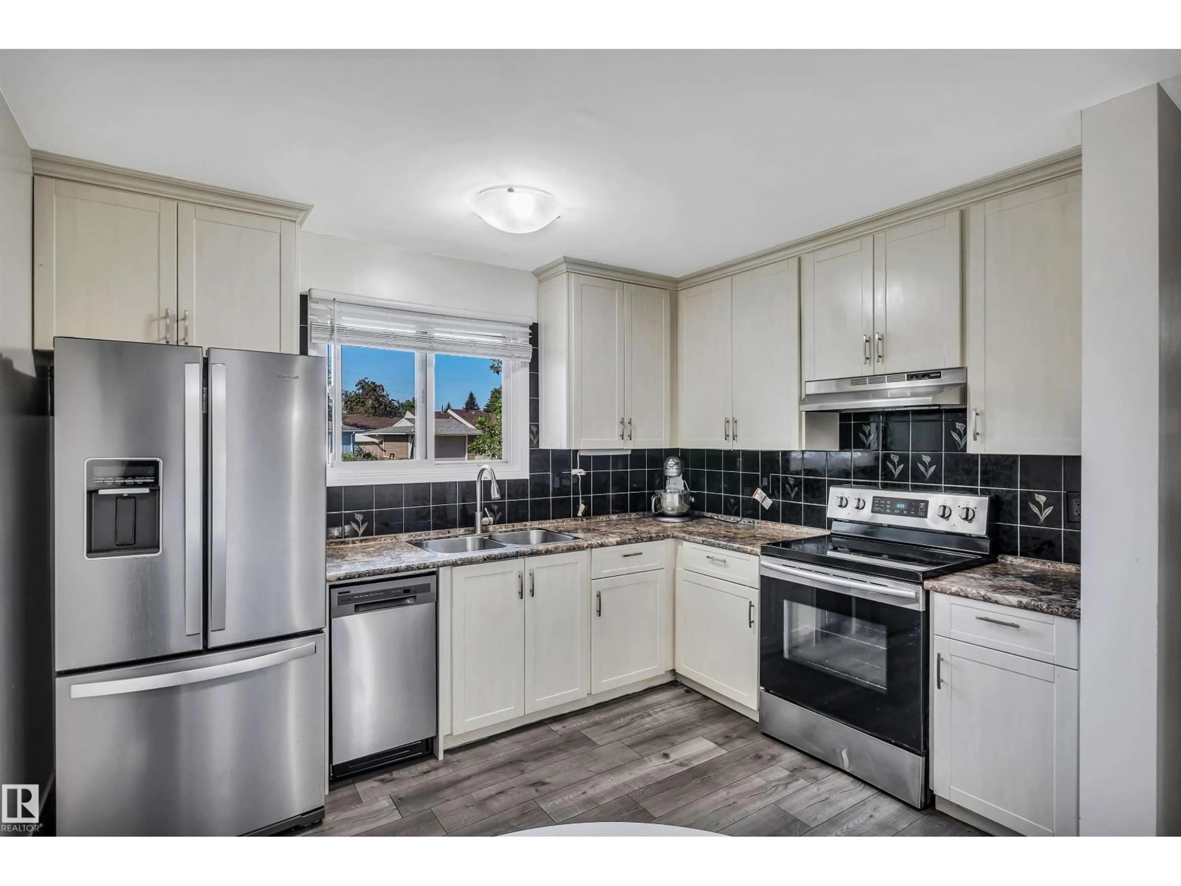 Open concept kitchen, ceramic/tile floor for 1616 LAKEWOOD RD, Edmonton Alberta T6K3H4