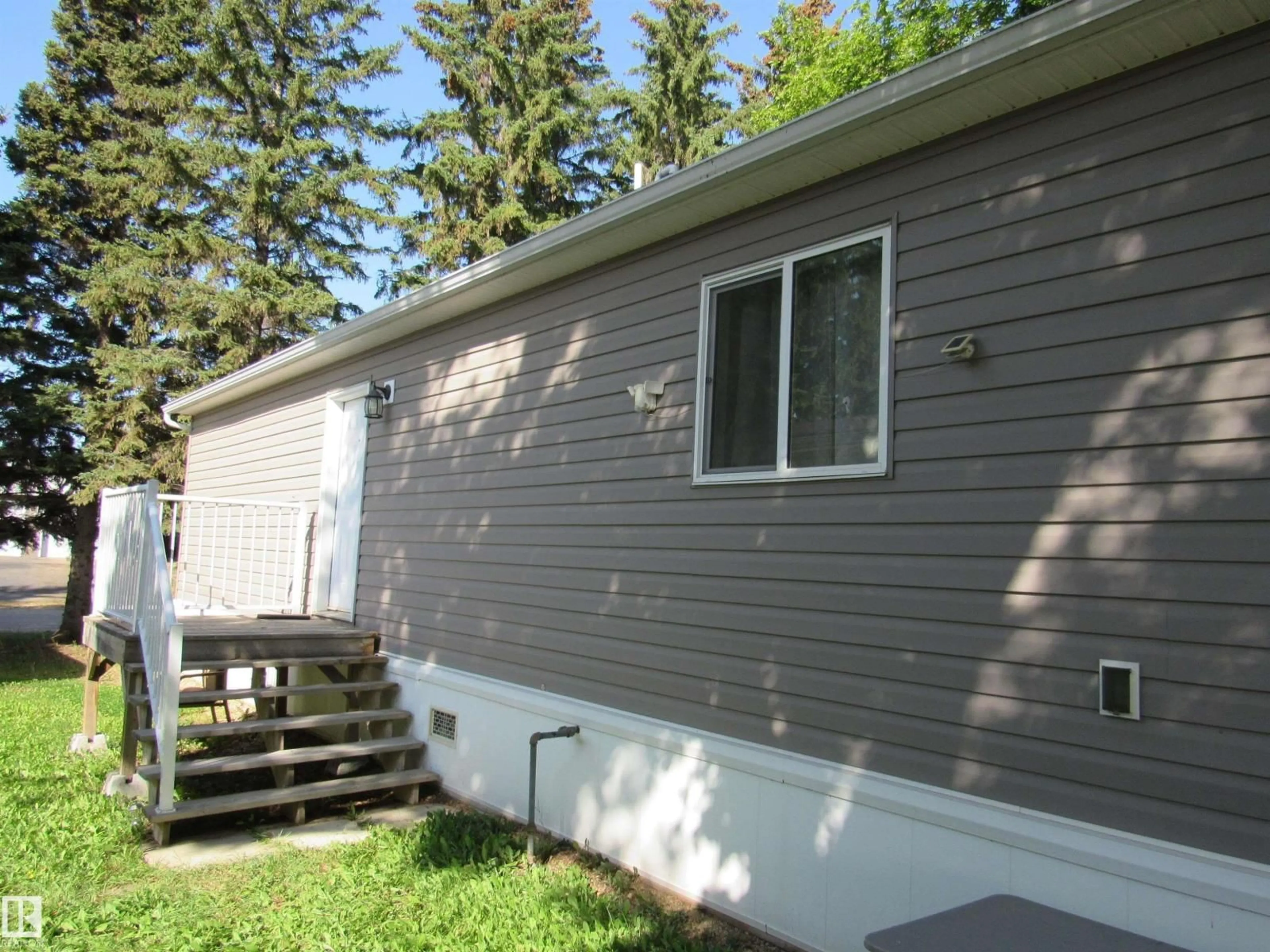 Home with vinyl exterior material, street for 3A - 4515 50 AVE, Barrhead Alberta T7N1J6