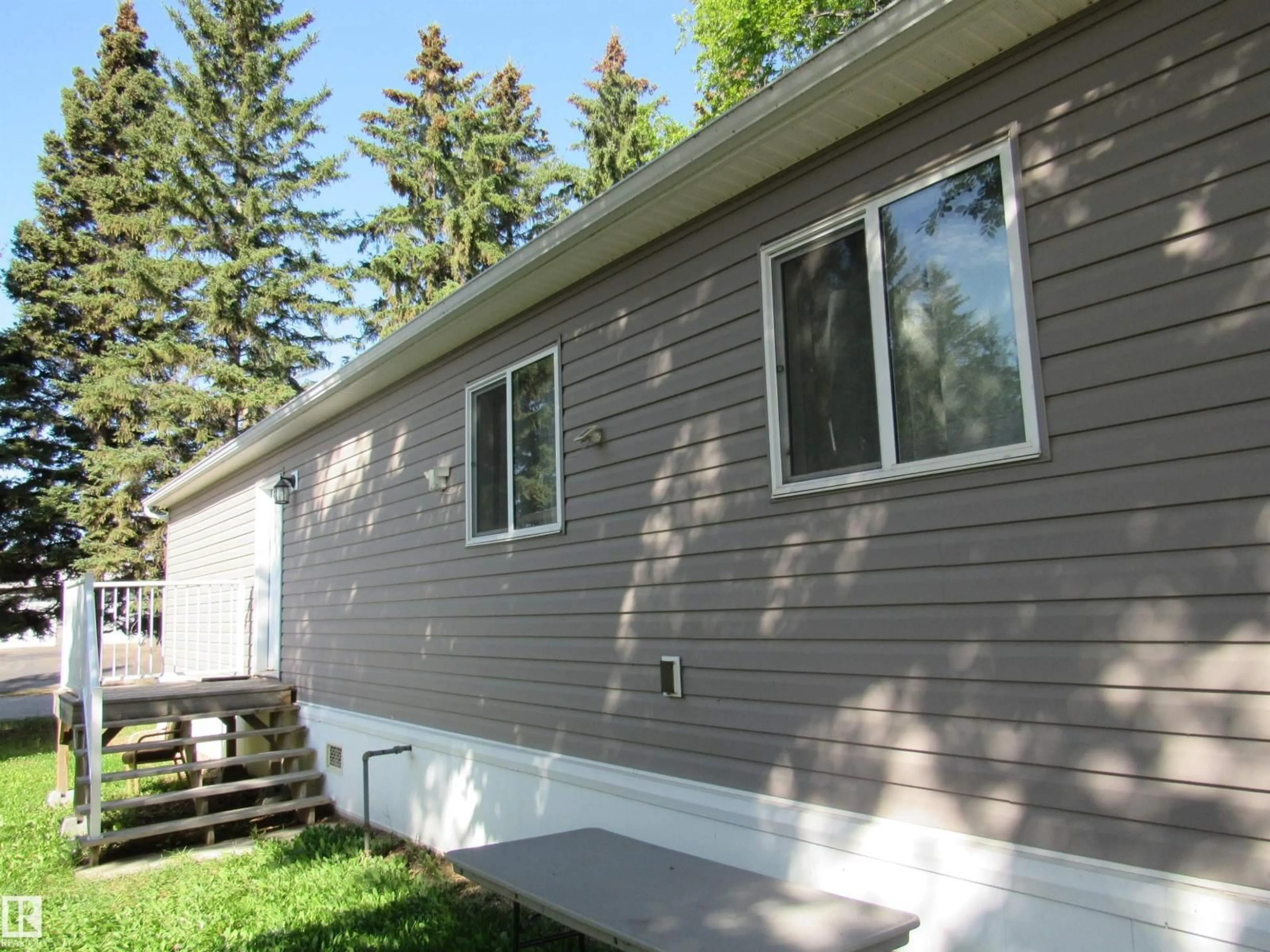 Home with vinyl exterior material, street for 3A - 4515 50 AVE, Barrhead Alberta T7N1J6