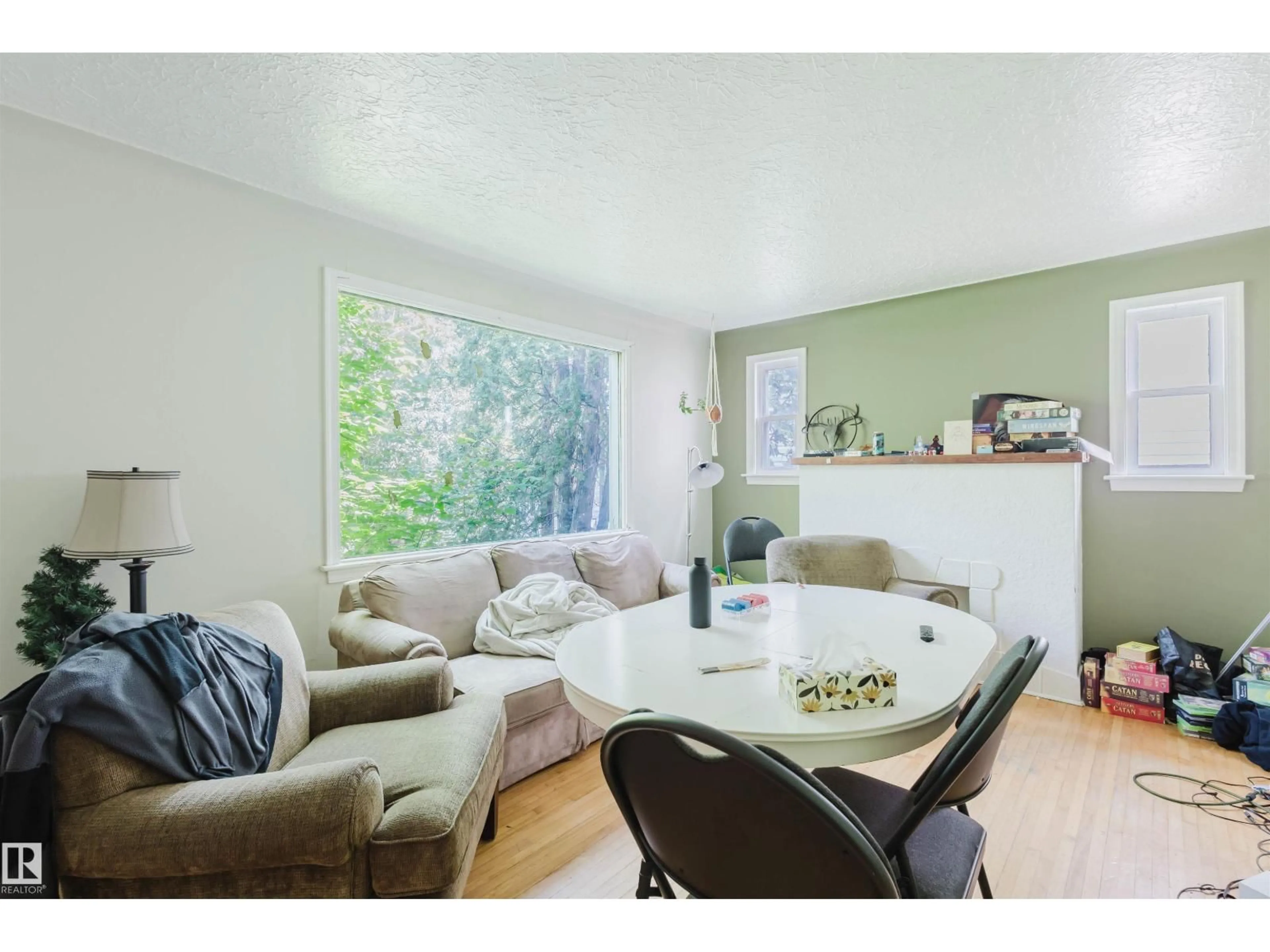 Living room with furniture, wood/laminate floor for 7230 112 ST, Edmonton Alberta T6G1J3