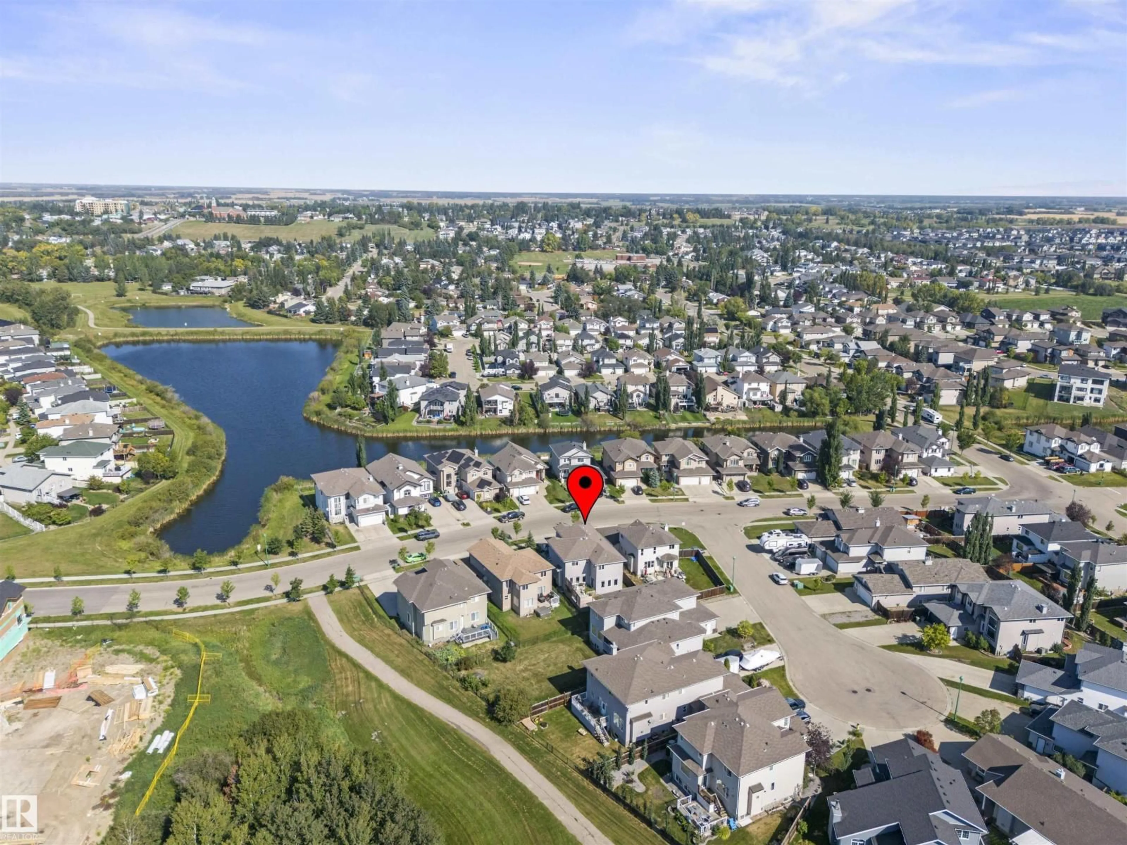 A pic from outside/outdoor area/front of a property/back of a property/a pic from drone, water/lake/river/ocean view for 115 LAKELAND DR, Beaumont Alberta T4X0B4