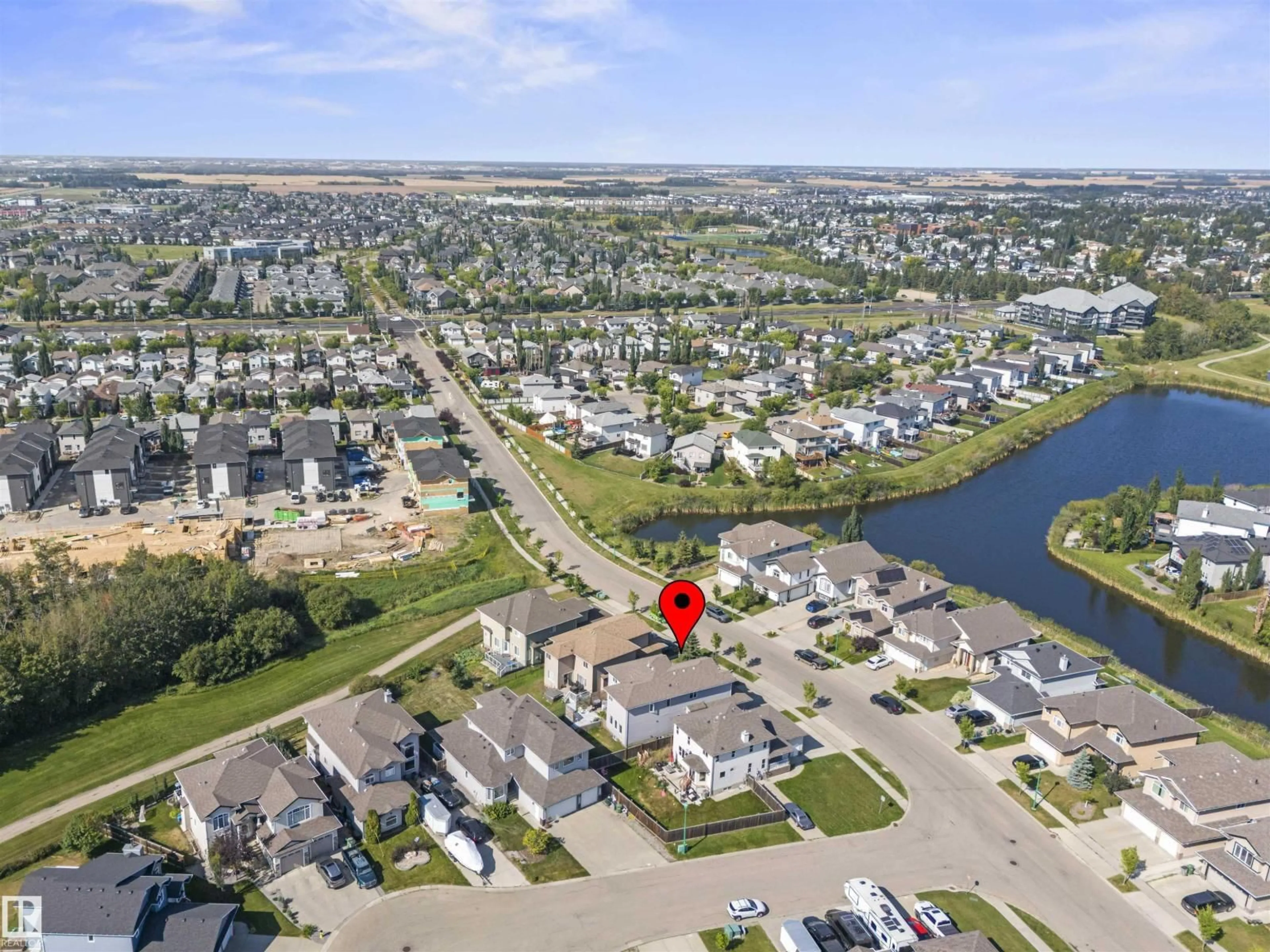 A pic from outside/outdoor area/front of a property/back of a property/a pic from drone, water/lake/river/ocean view for 115 LAKELAND DR, Beaumont Alberta T4X0B4