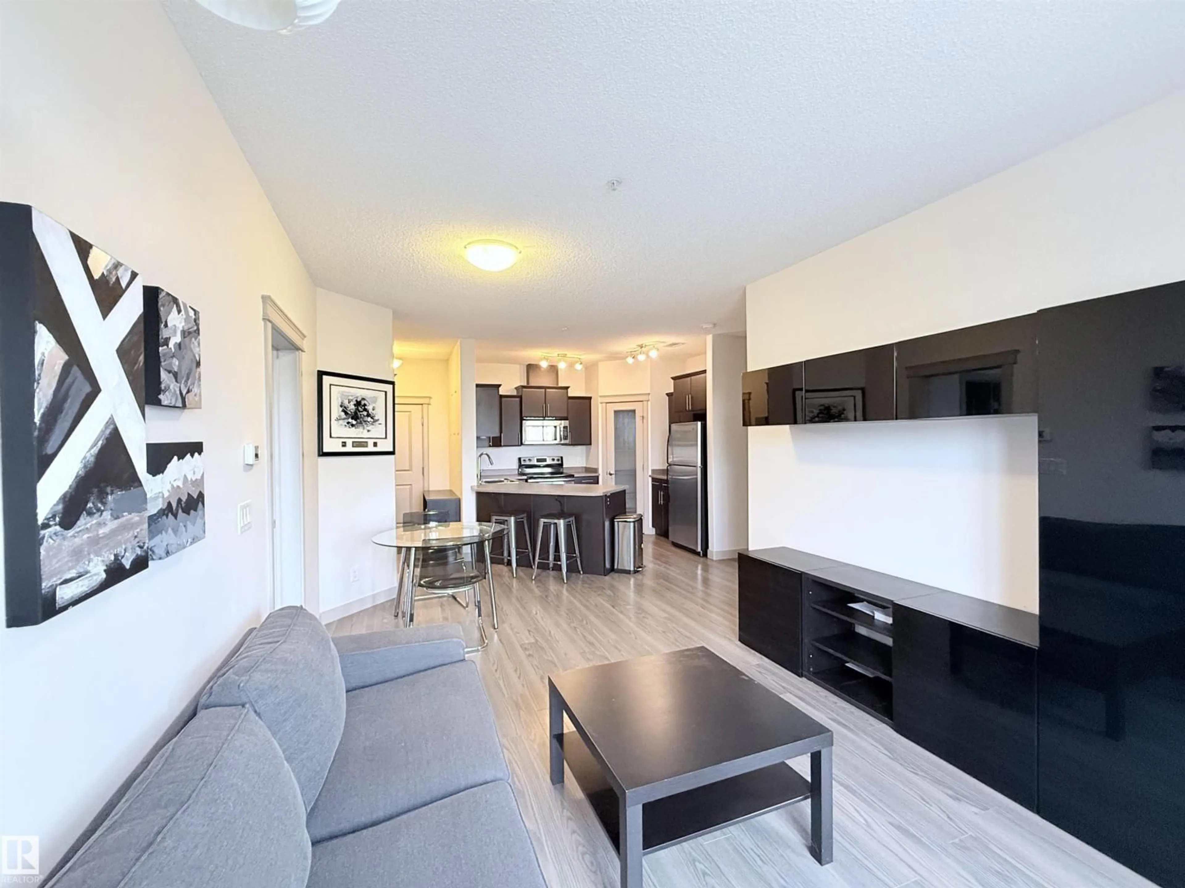 Living room with furniture, wood/laminate floor for #205 - 4075 CLOVER BAR RD, Sherwood Park Alberta T8H0R6