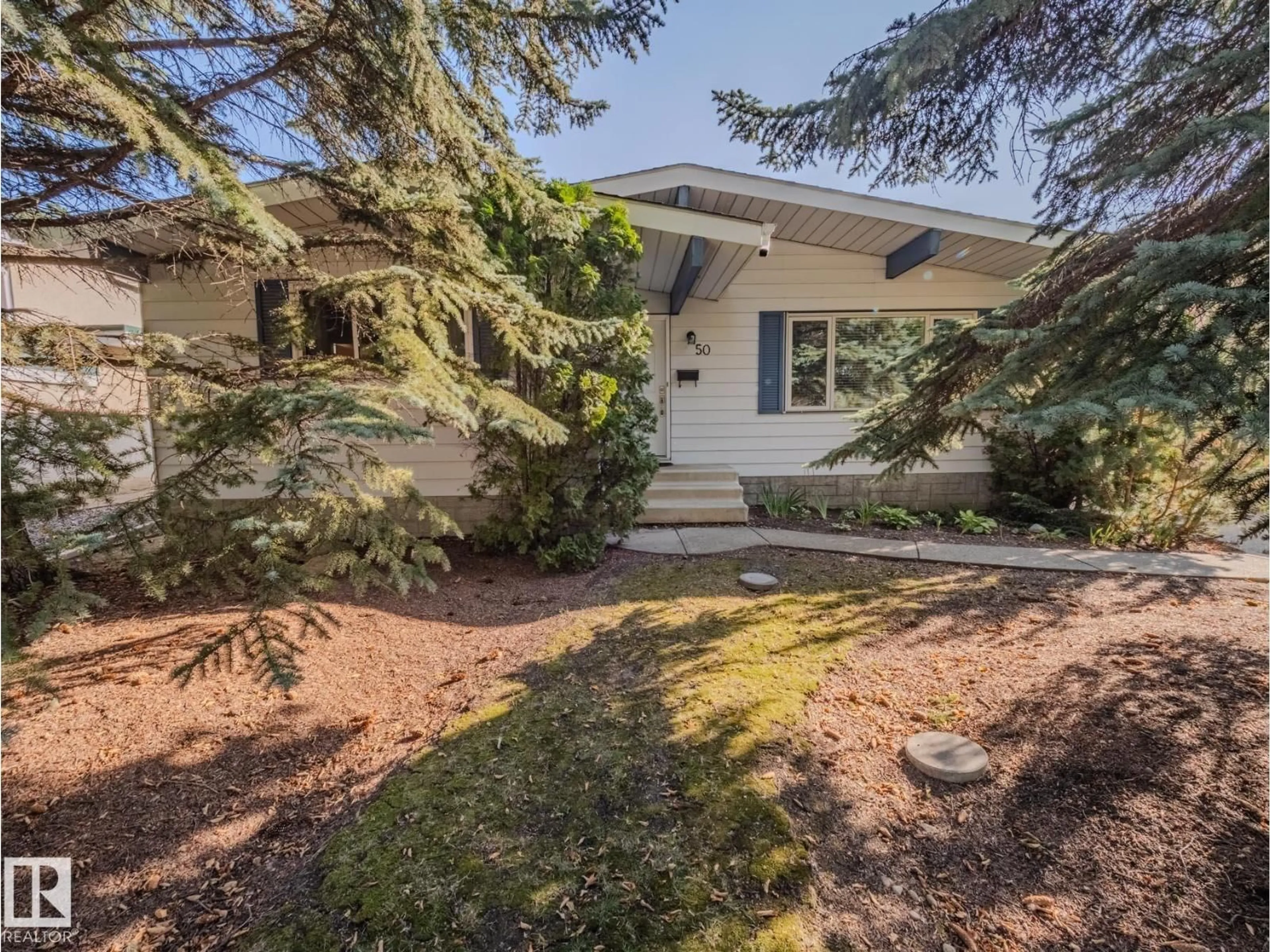 Home with vinyl exterior material, street for 50 FLAGSTONE CR, St. Albert Alberta T8N1R3