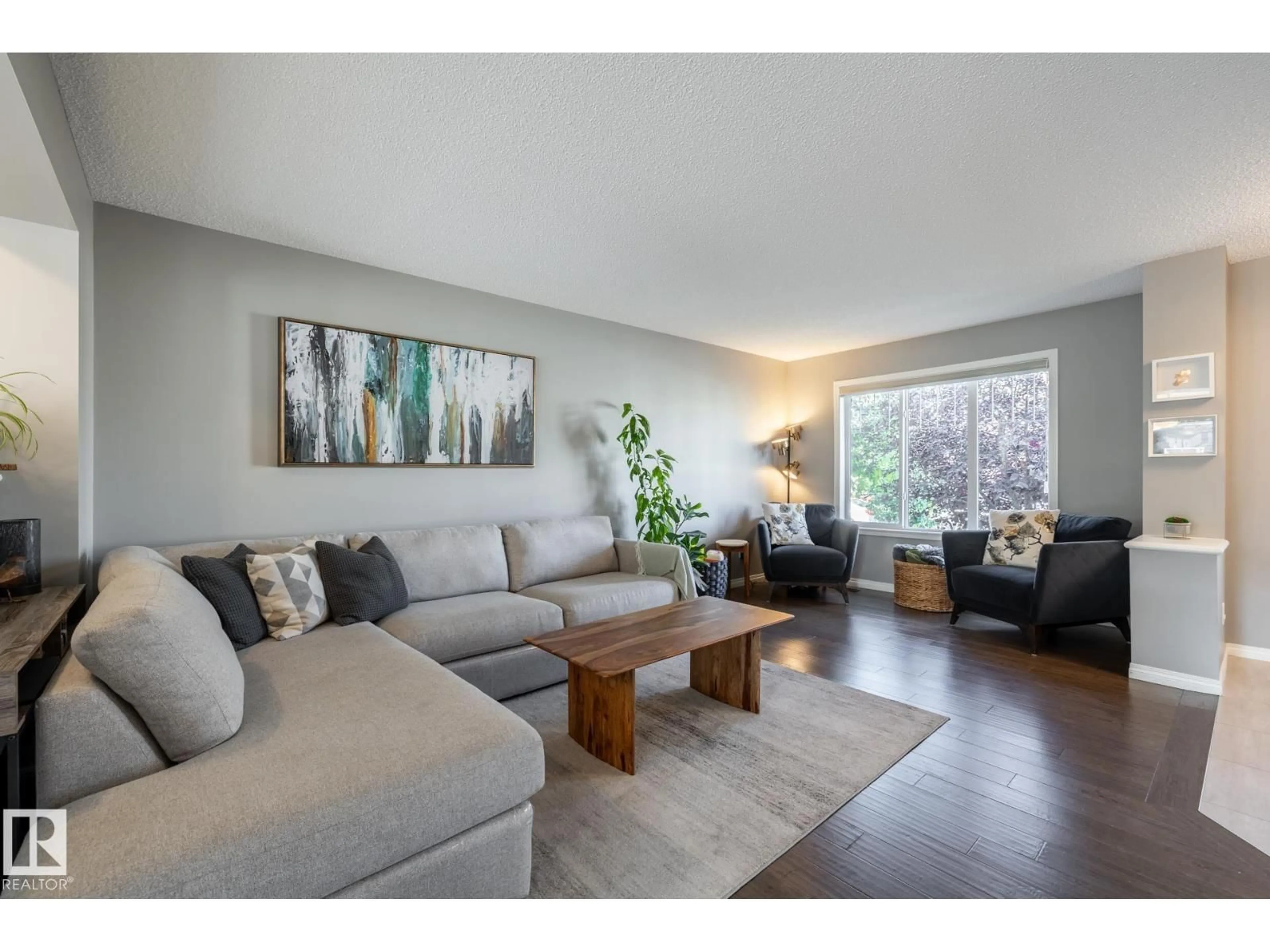 Living room with furniture, wood/laminate floor for SW - 2339 83 ST, Edmonton Alberta T6X2G8