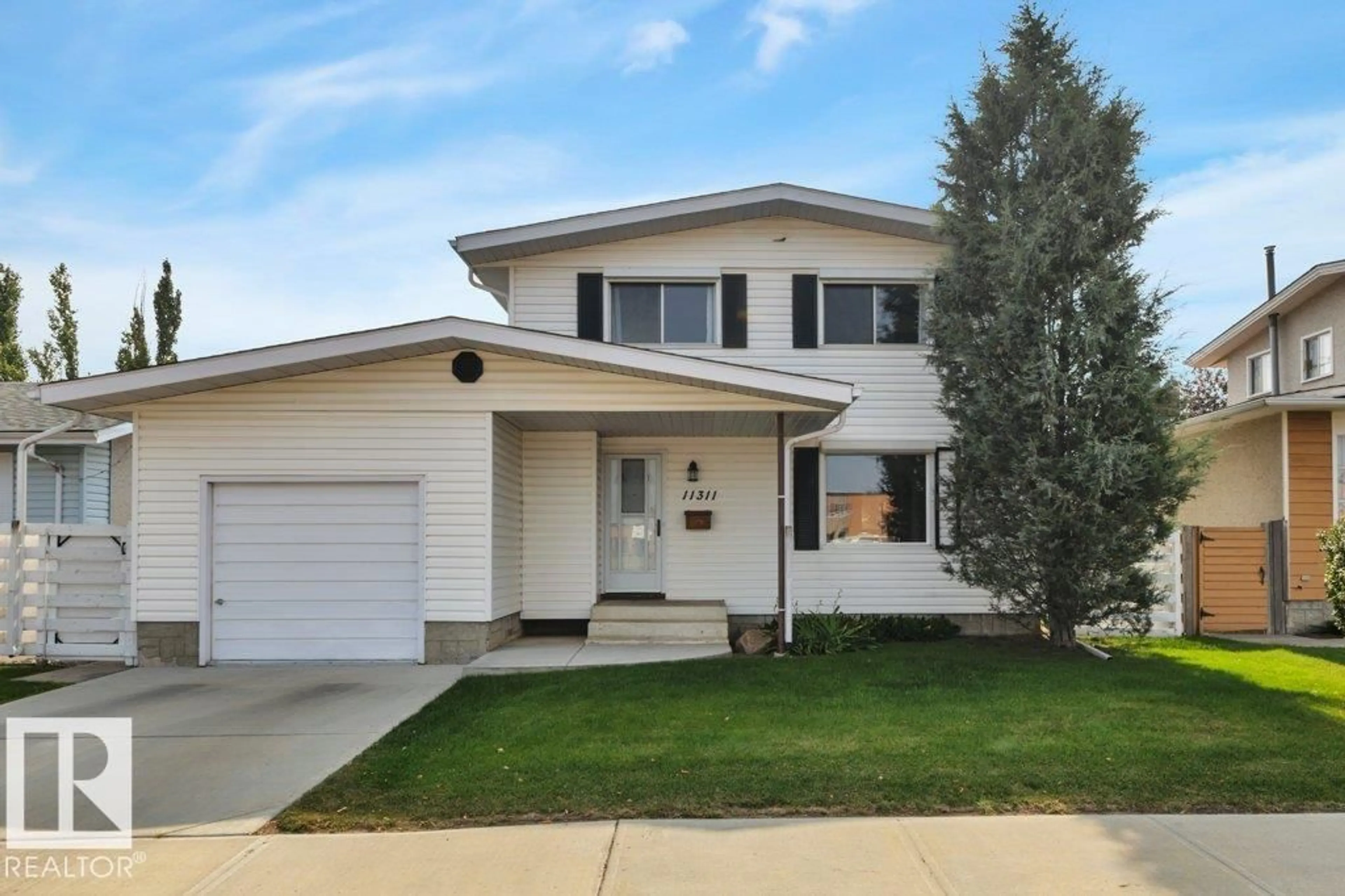 Home with vinyl exterior material, street for 11311 43 AV, Edmonton Alberta T6J0X9