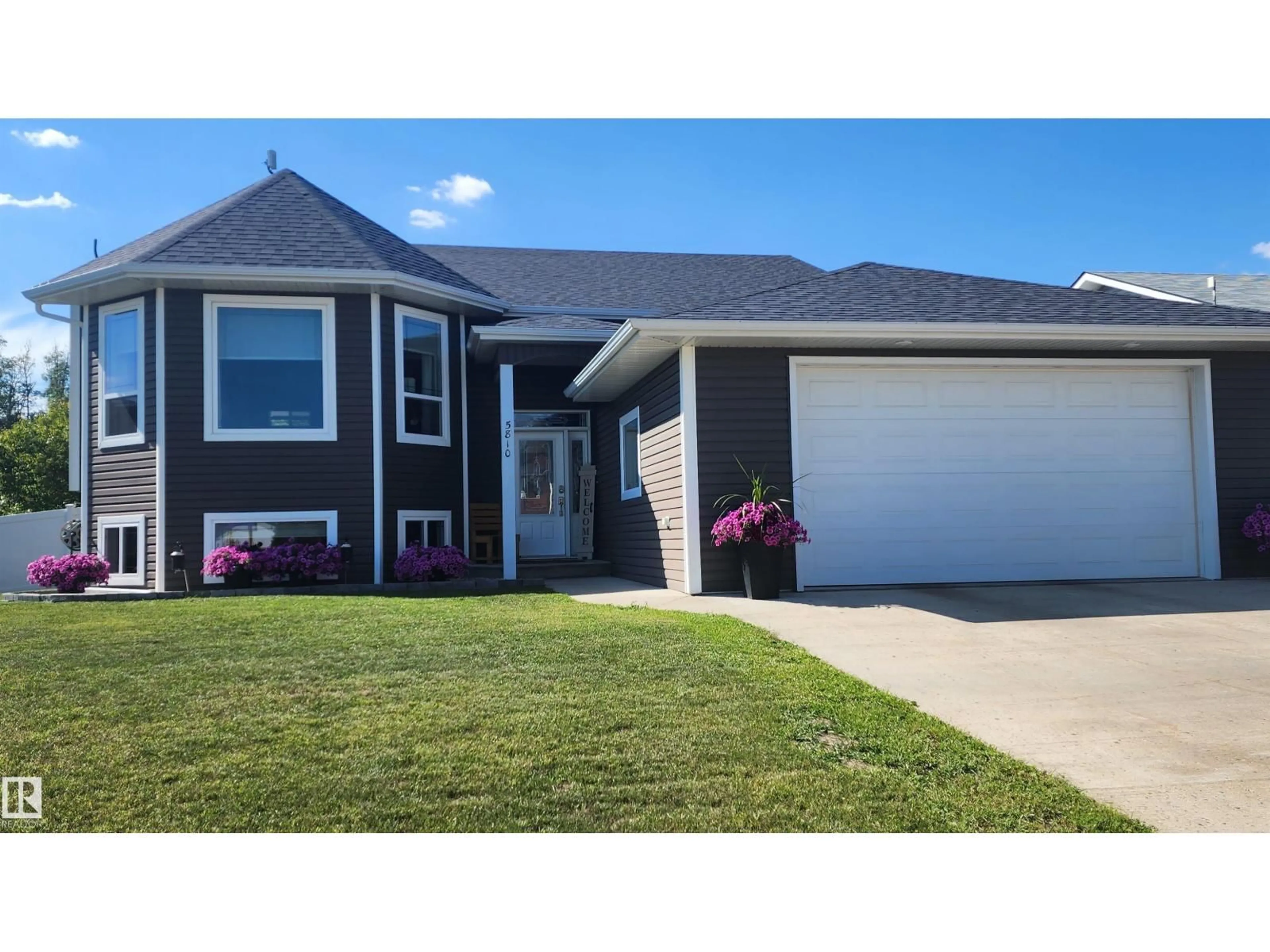 Home with vinyl exterior material, street for 5810 CENTENNIAL DR, Elk Point Alberta T0A1A0