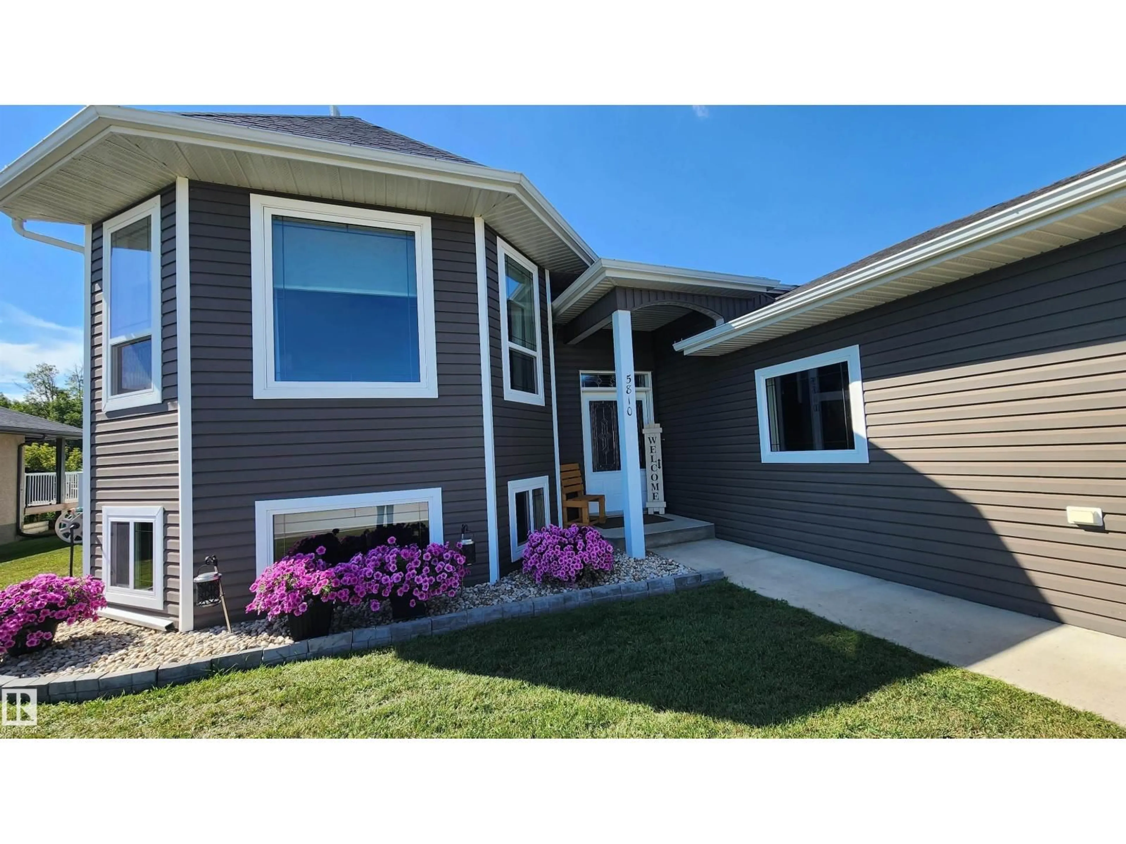Home with vinyl exterior material, street for 5810 CENTENNIAL DR, Elk Point Alberta T0A1A0